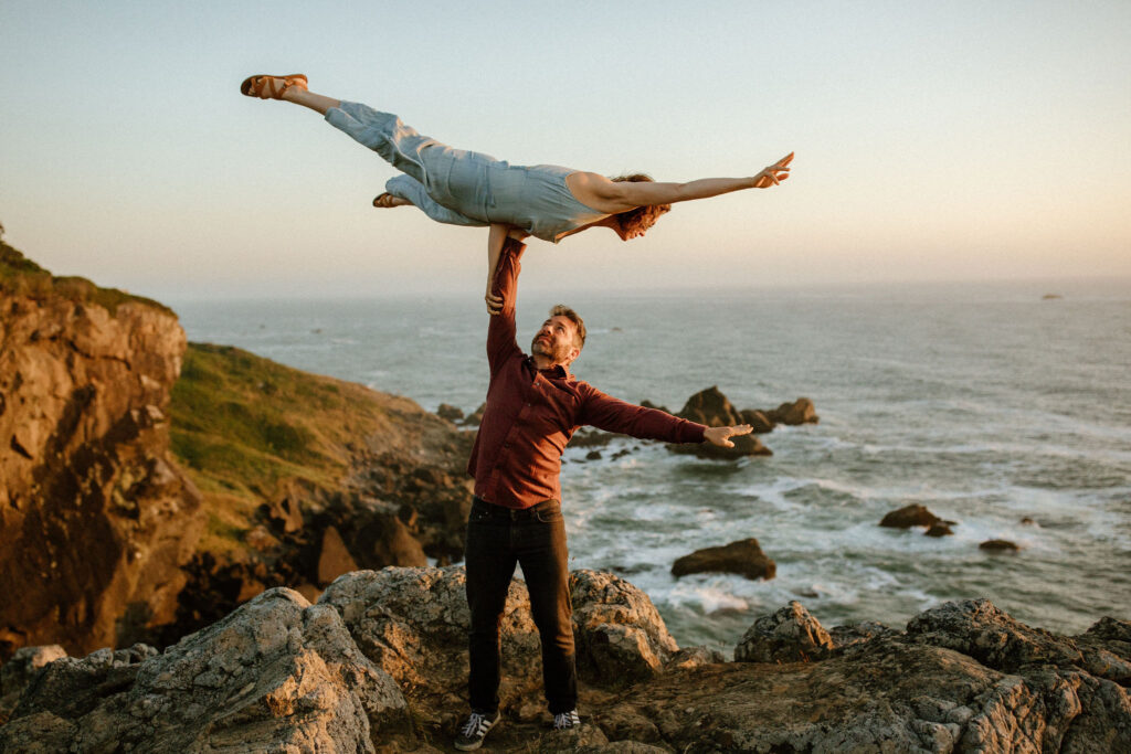 Couple doing acrobats during engagement session