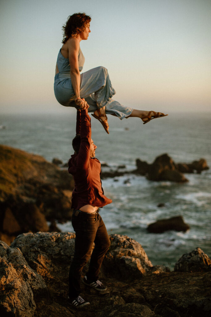 Couple doing acrobats during engagement session