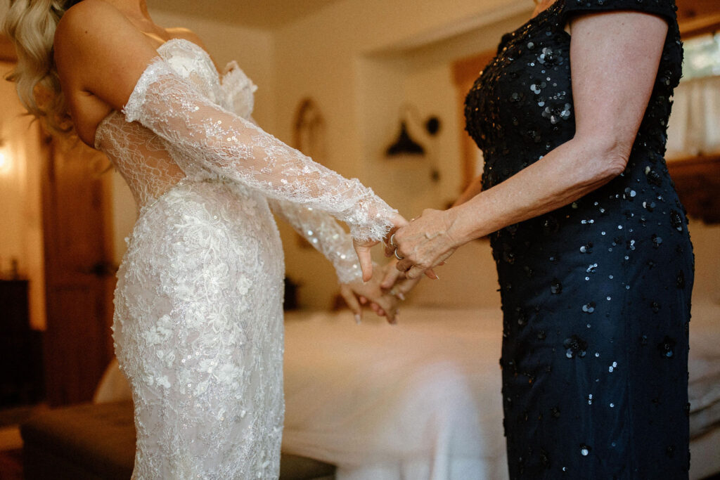 Bride getting ready for her wedding with her mother