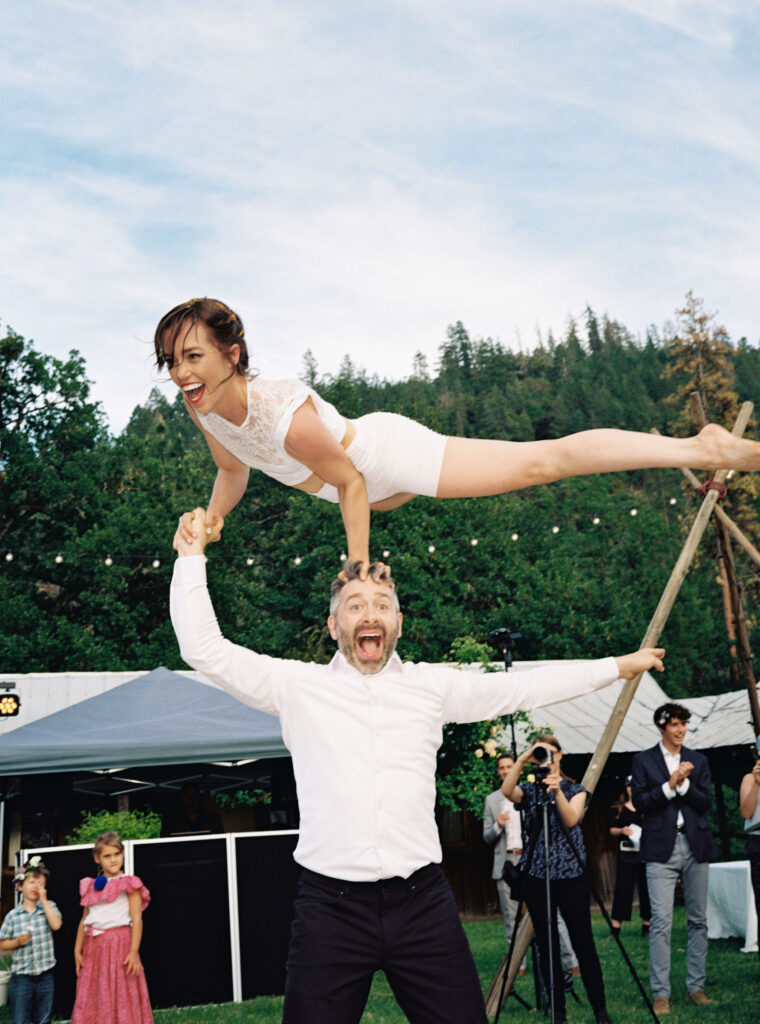 Bride and groom doing acrobats during wedding reception