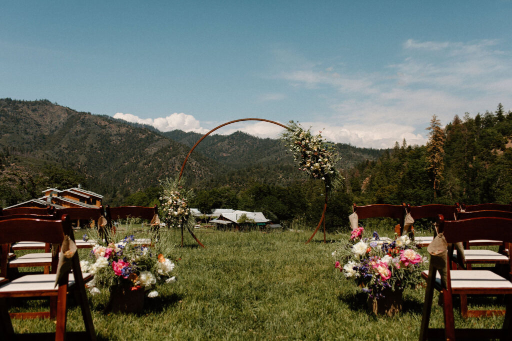 Outdoor summer camp wedding ceremony at Bar 717 Ranch