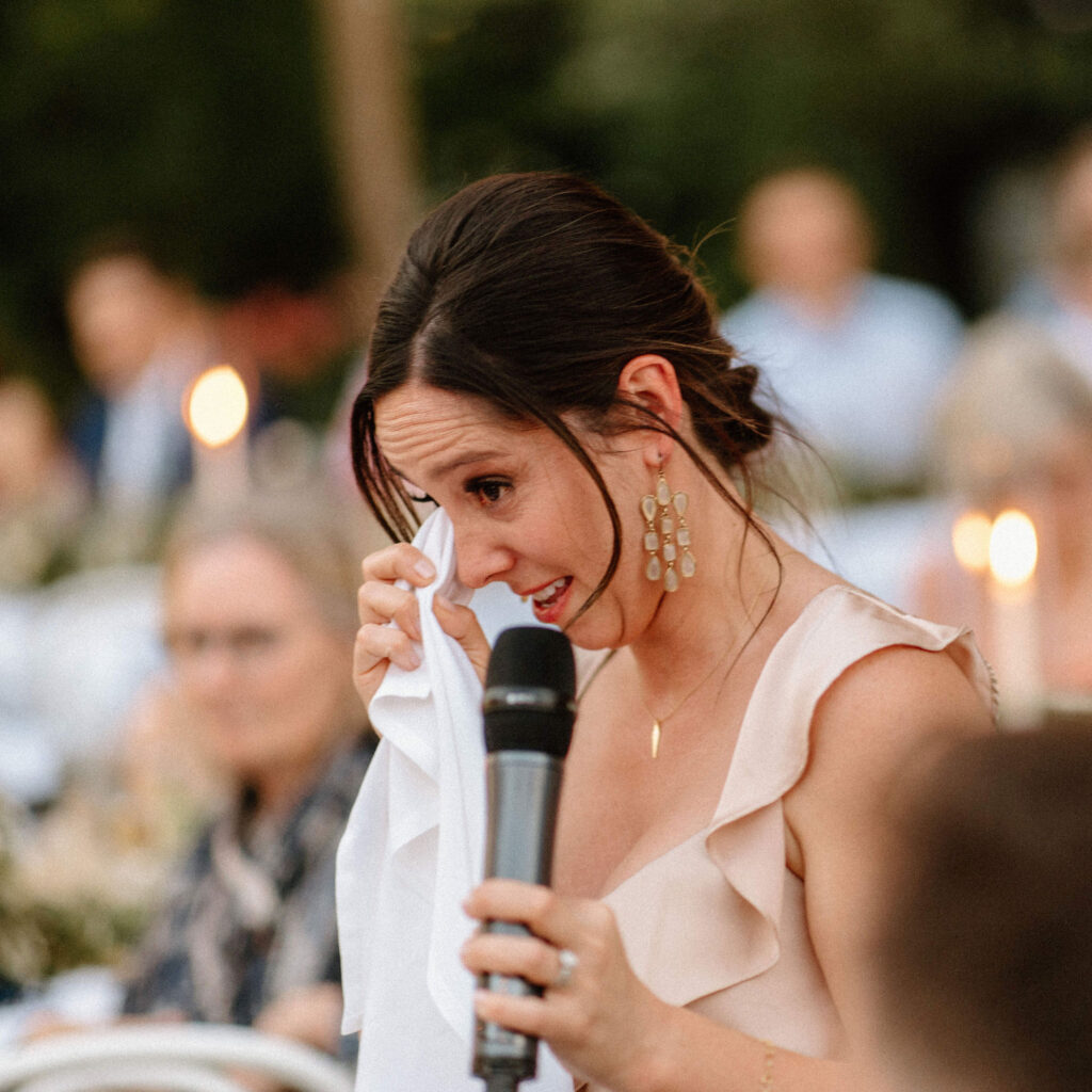 Bridesmaid crying giving wedding speech