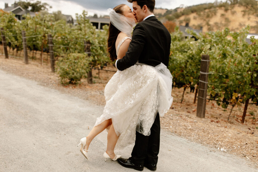 Bride and groom portraits in a vineyard from a Four Seasons Napa Valley wedding