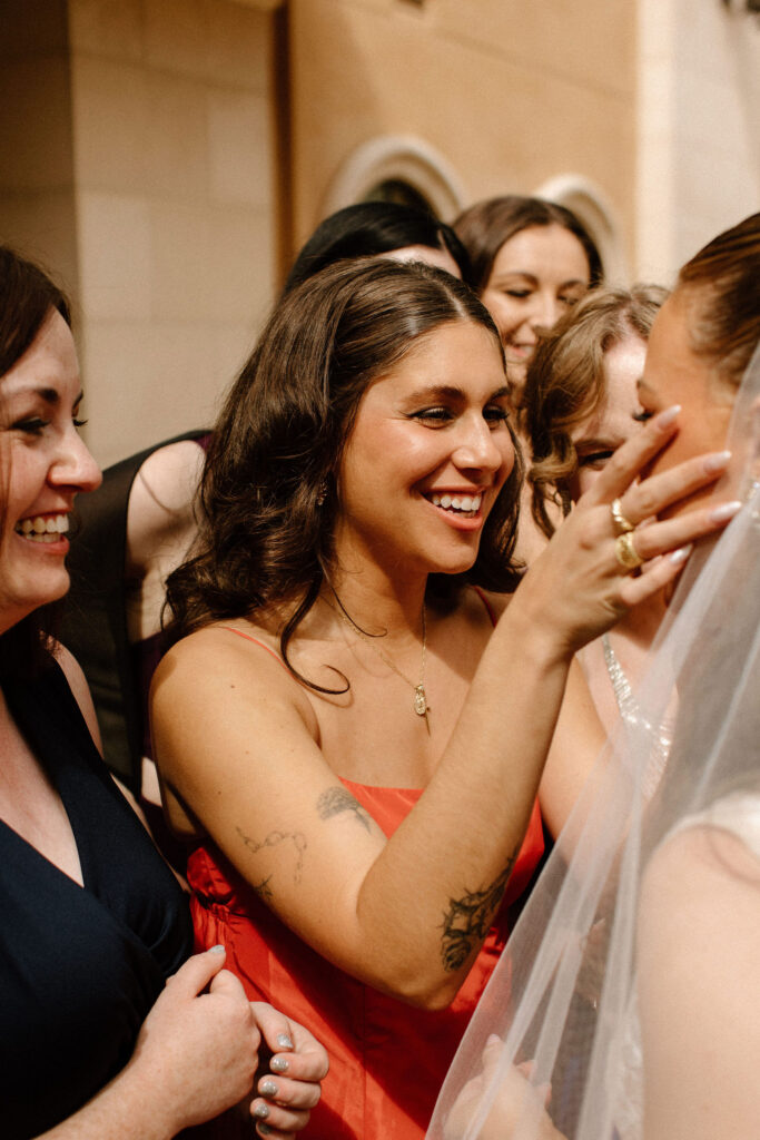 Brides emotional first looks with bridesmaids
