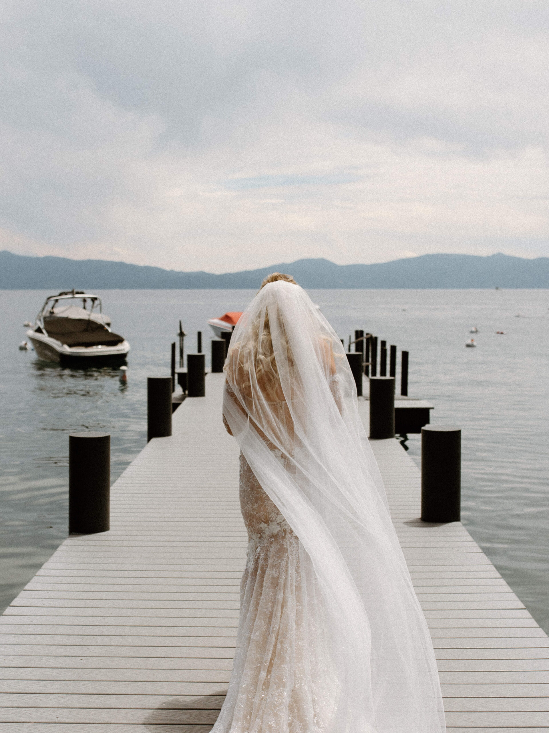 bride poses on the beautiful lake tahoe dock 