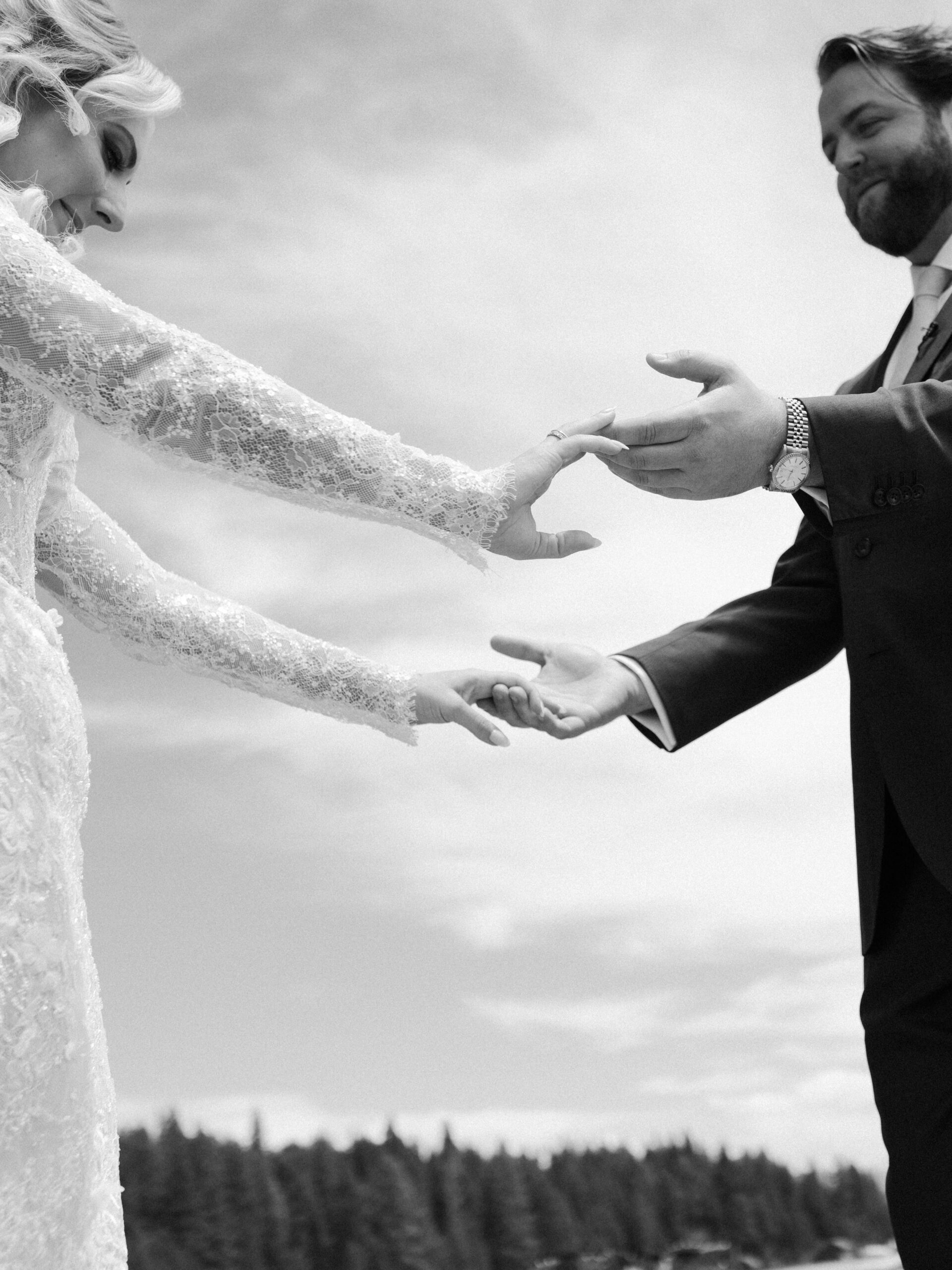 bride and groom pose together holding hands