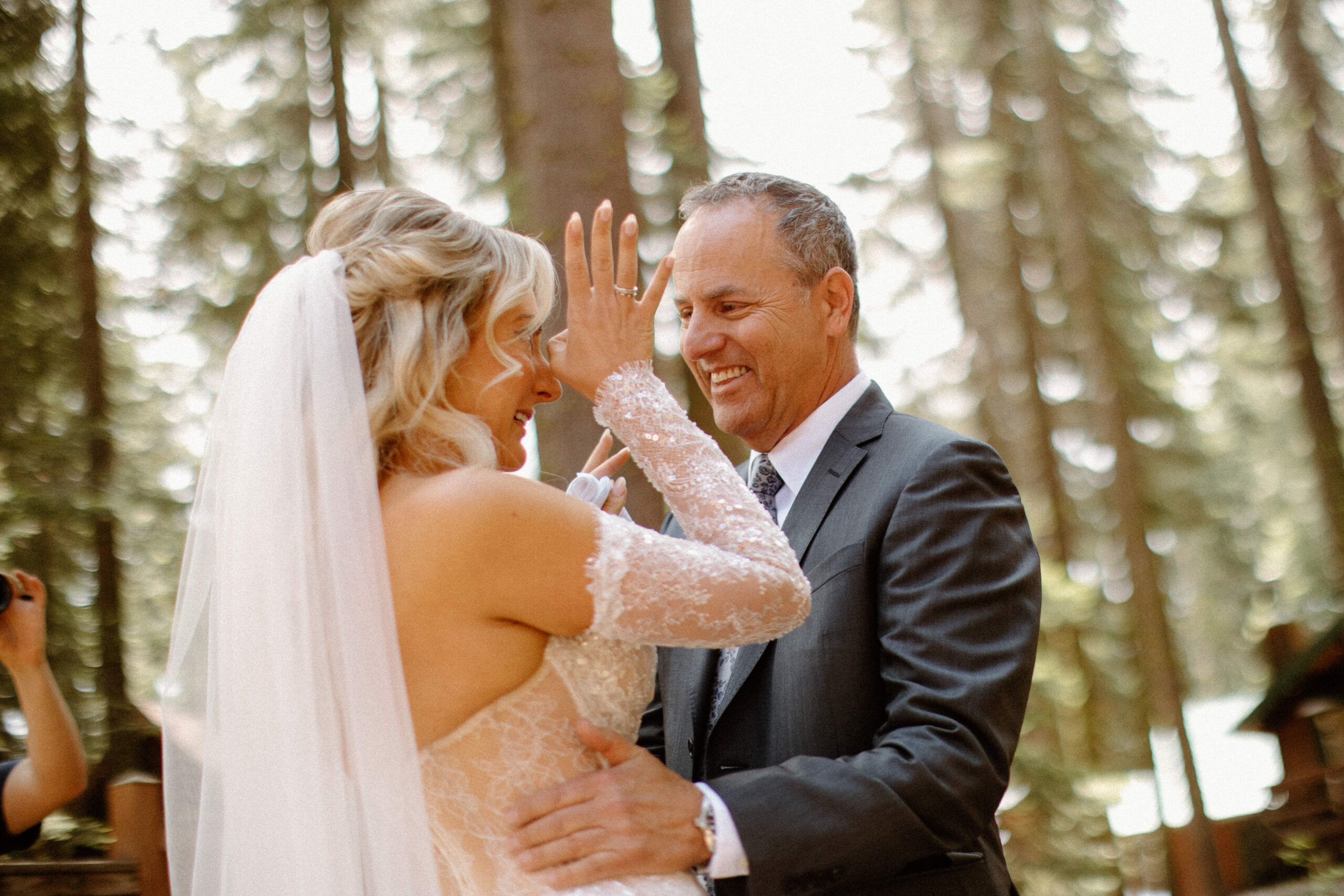 stunning bride poses with her dad before her dreamy wedding day