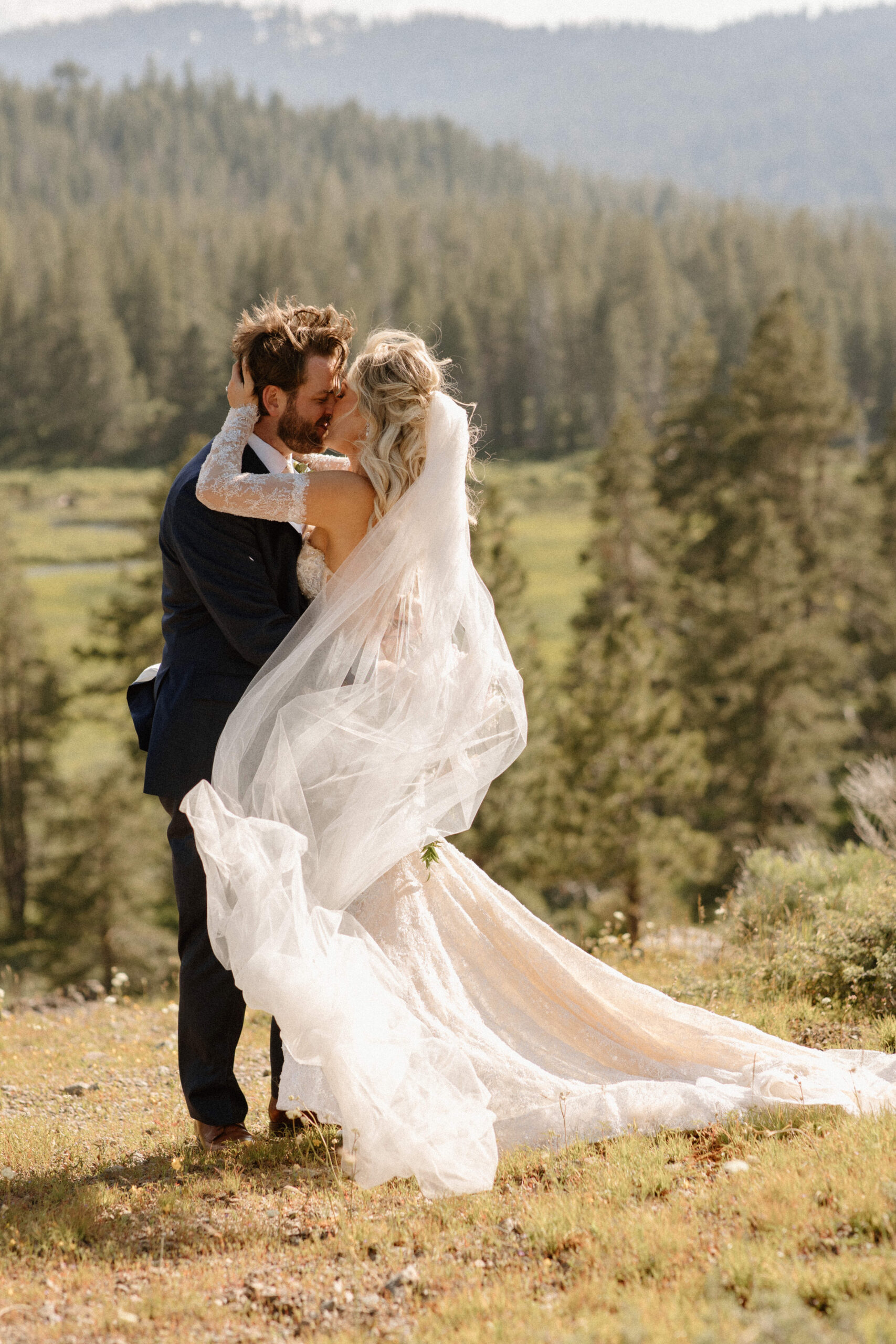stunning bride and groom pose with the valley in the background after their dreamy Lake Tahoe Wedding at Dancing Pines