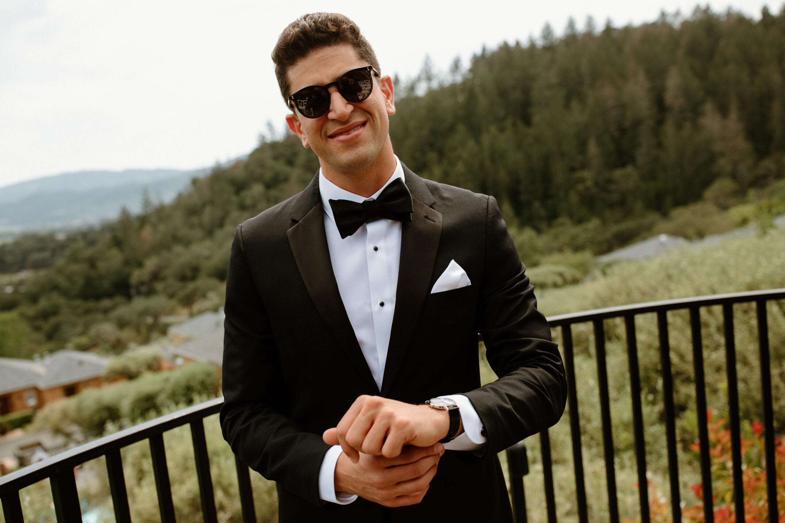 groom poses before his California wedding day