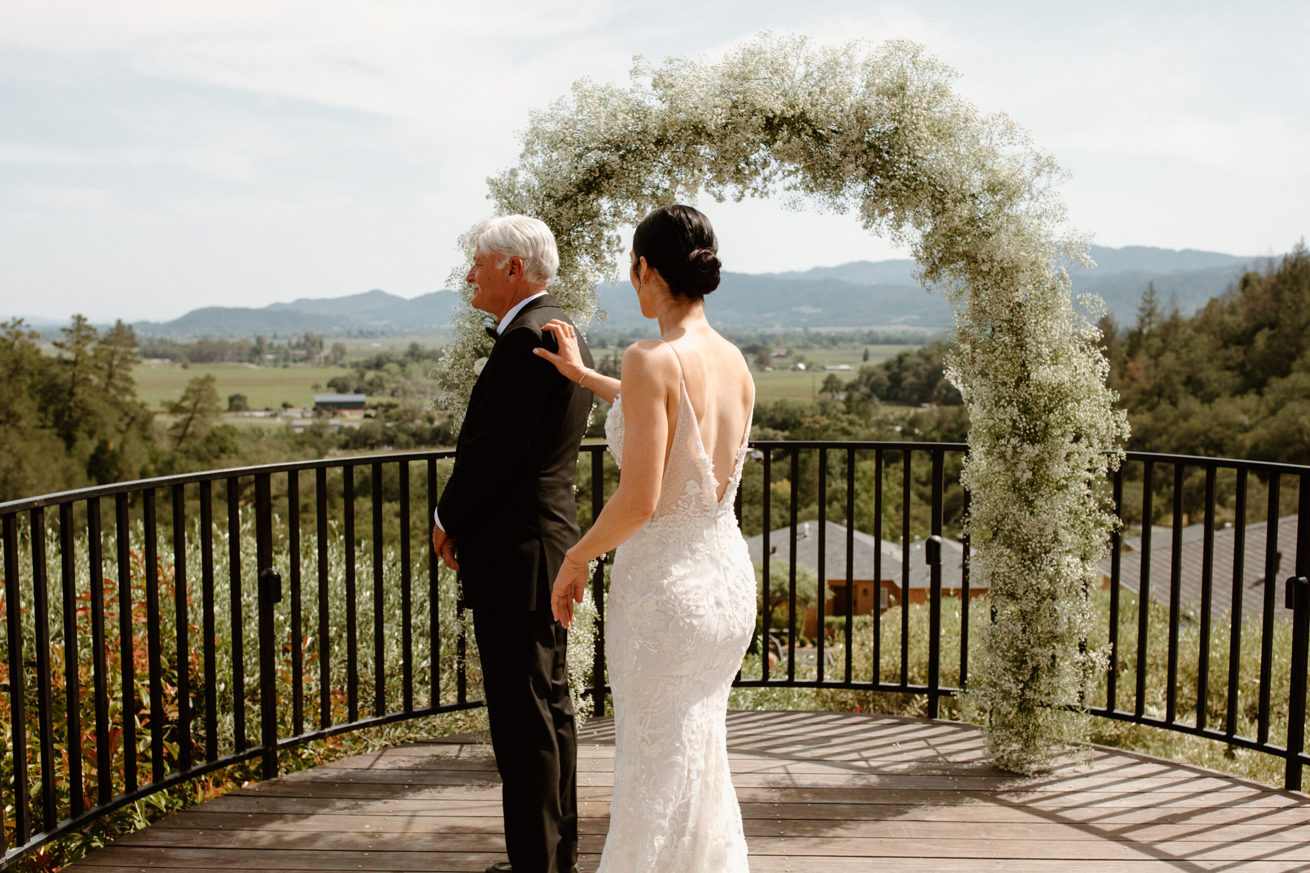 bride shares a first look session with her father