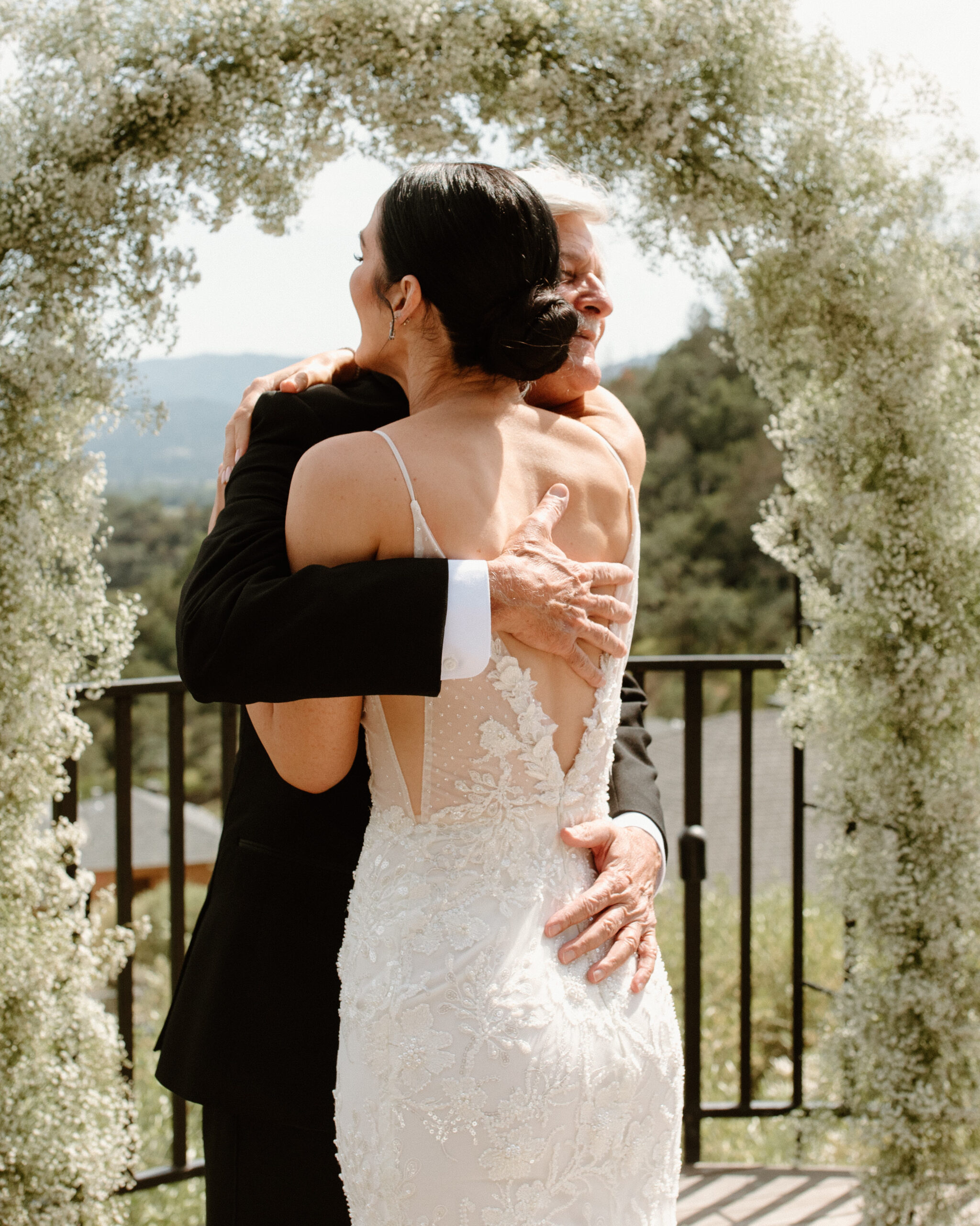 bride shares a first look session with her father