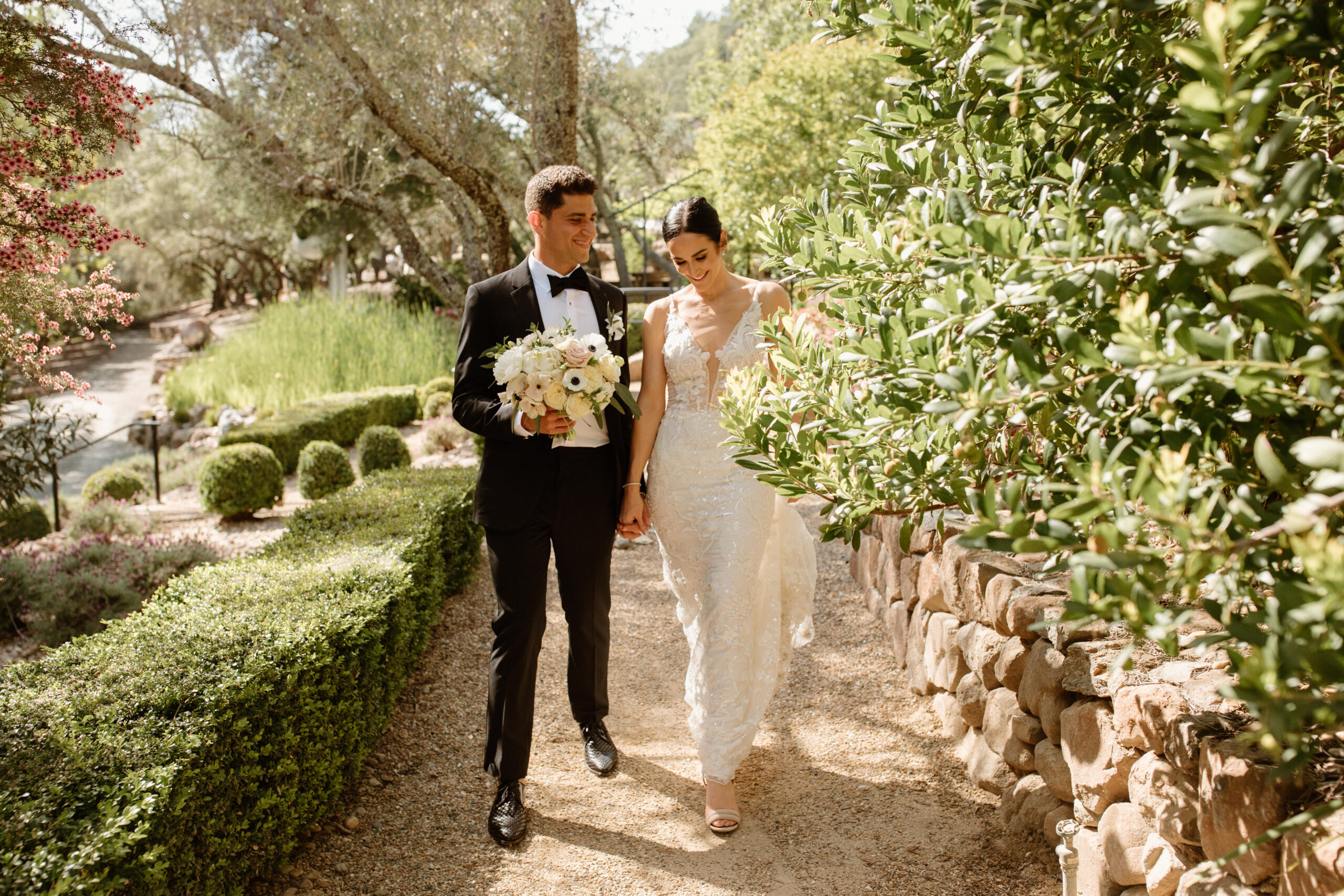 bride and groom pose together before their dreamy California wedding ceremony