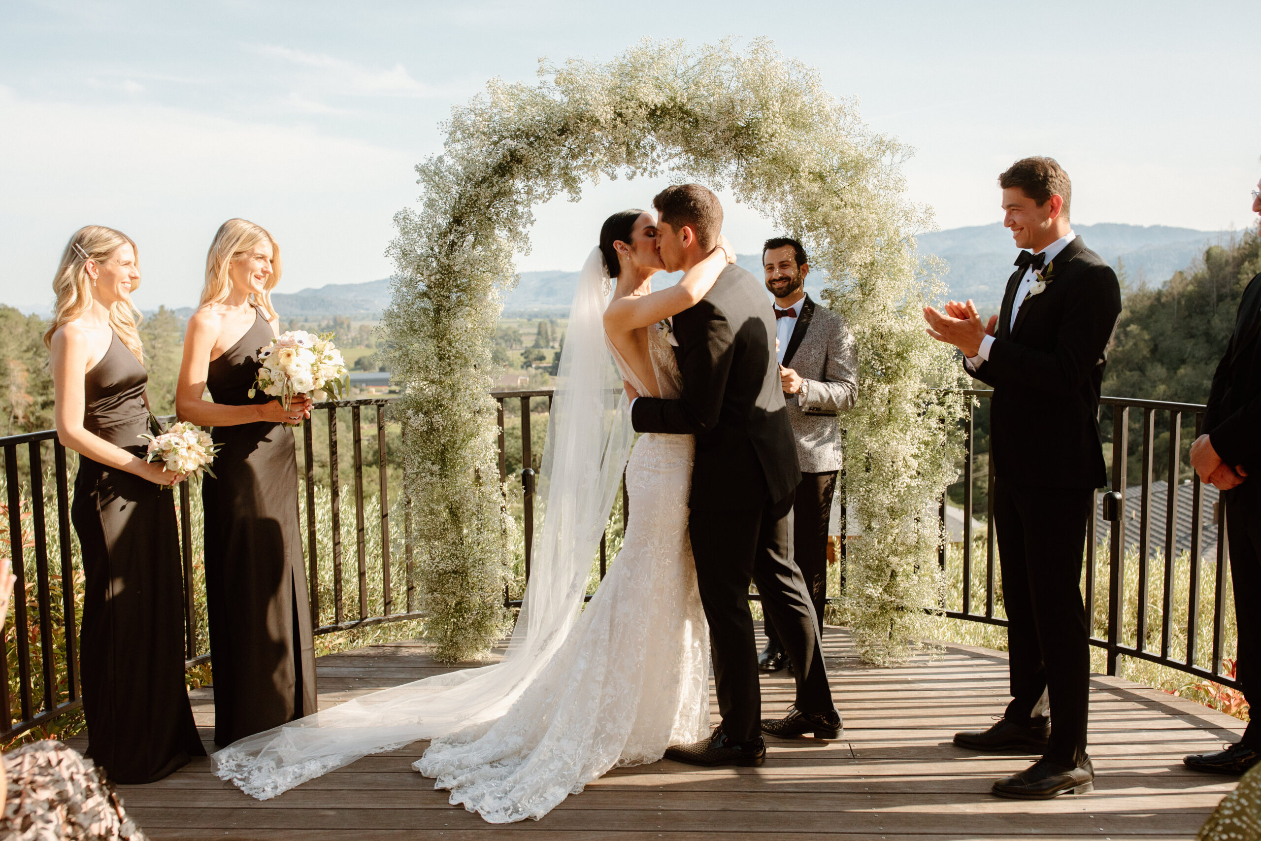 bride and groom share their first kiss as a married couple during their dreamy California mountain view ca wedding 