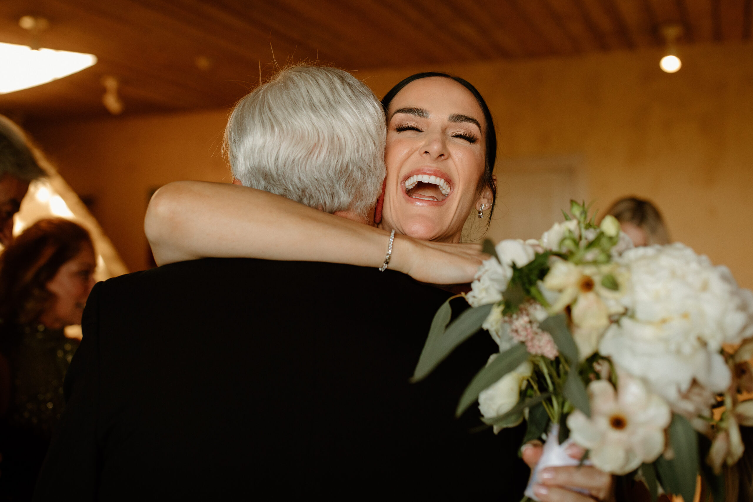 bride embraces her dad after her beautiful California wedding day