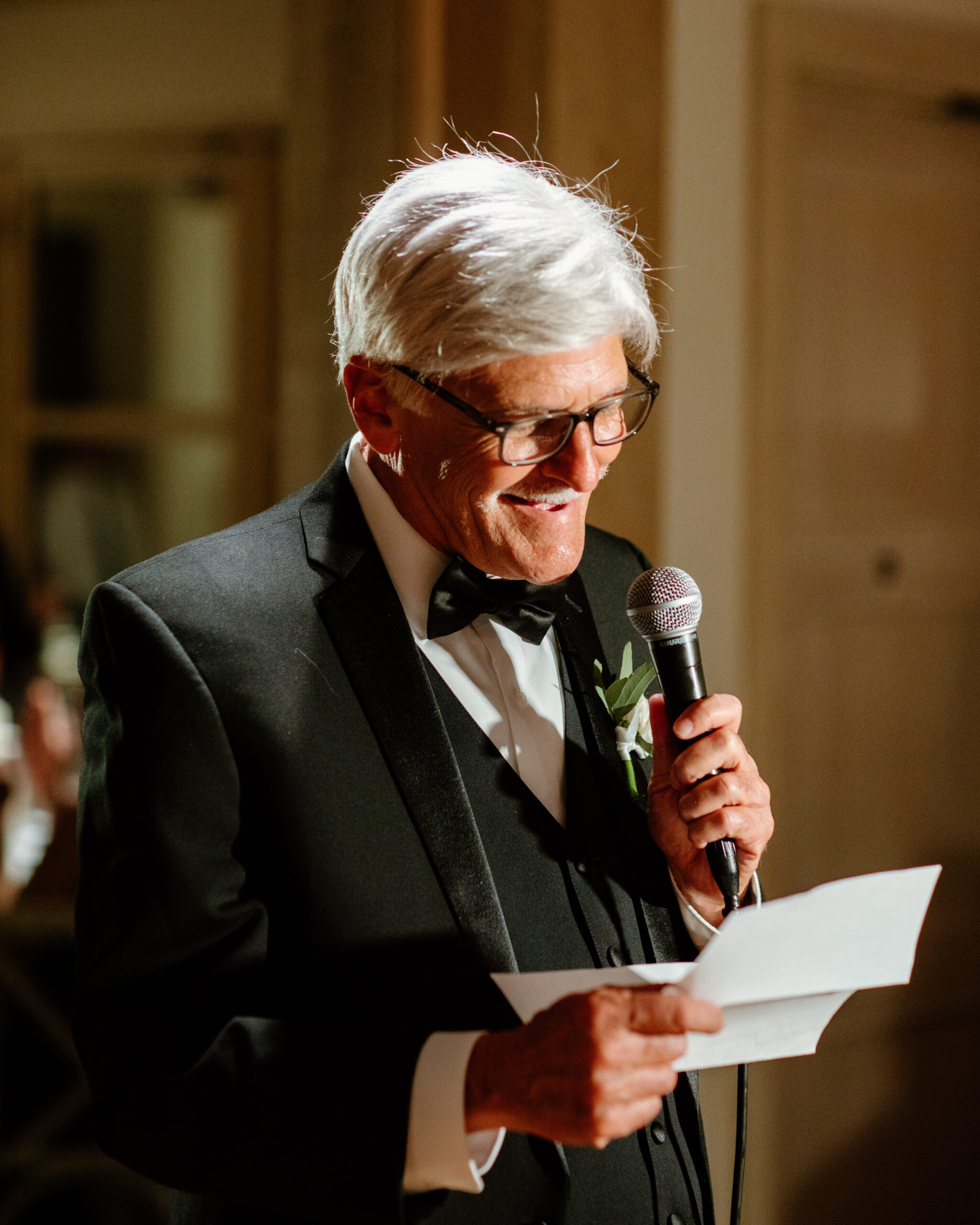 brides dad gives a speech at the elegant wedding reception