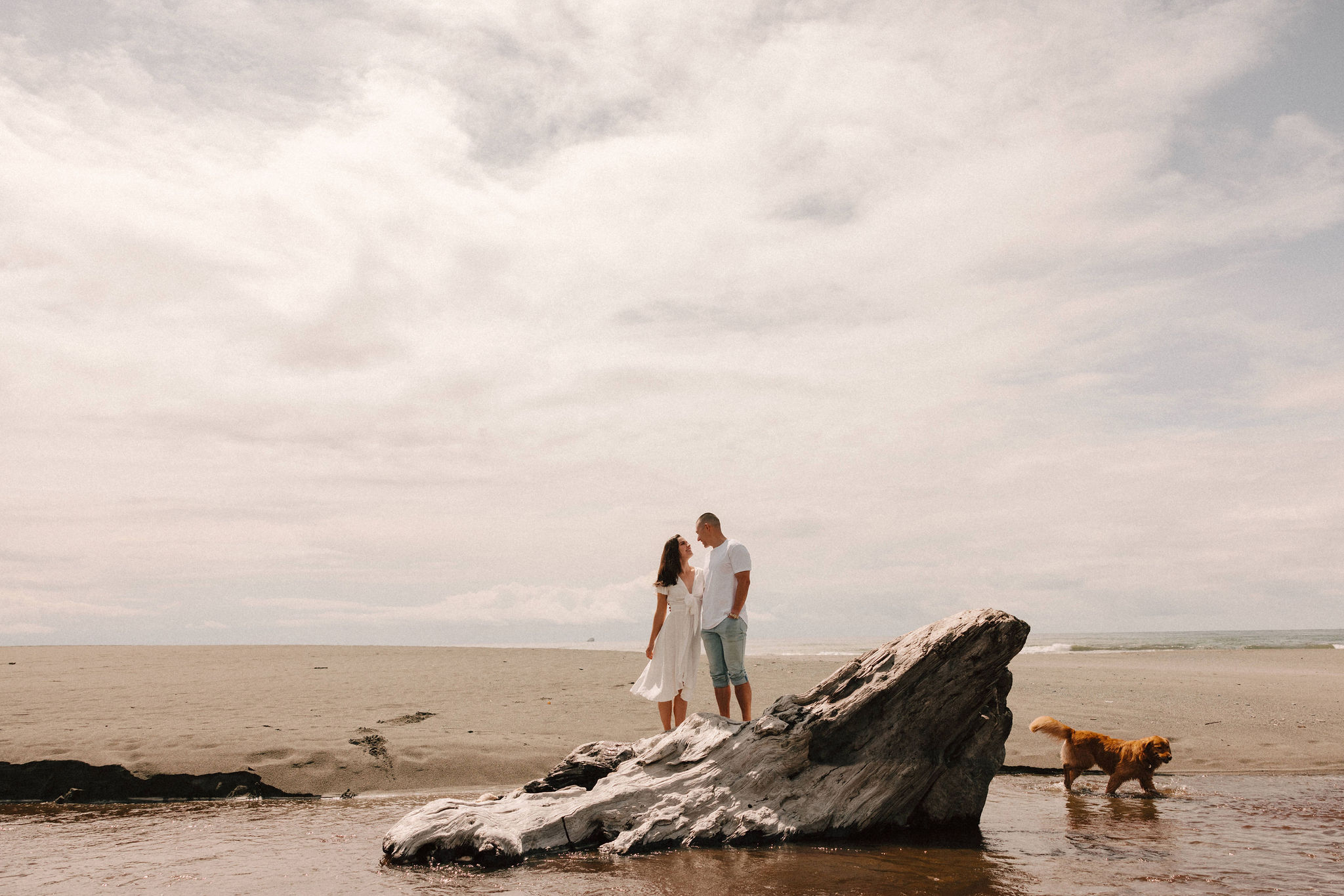 couple pose together on the California coast