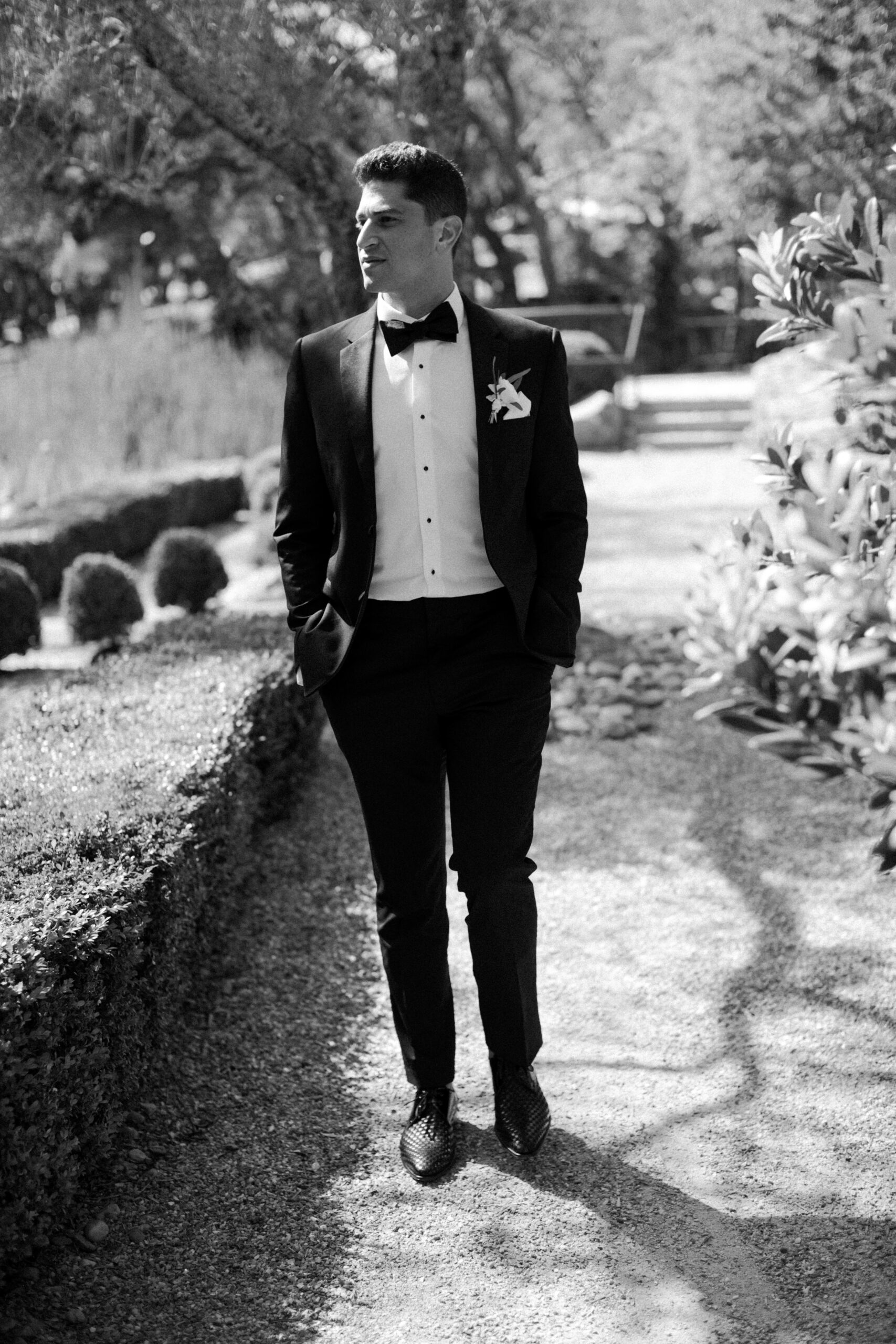 groom poses for a photo after his wedding day