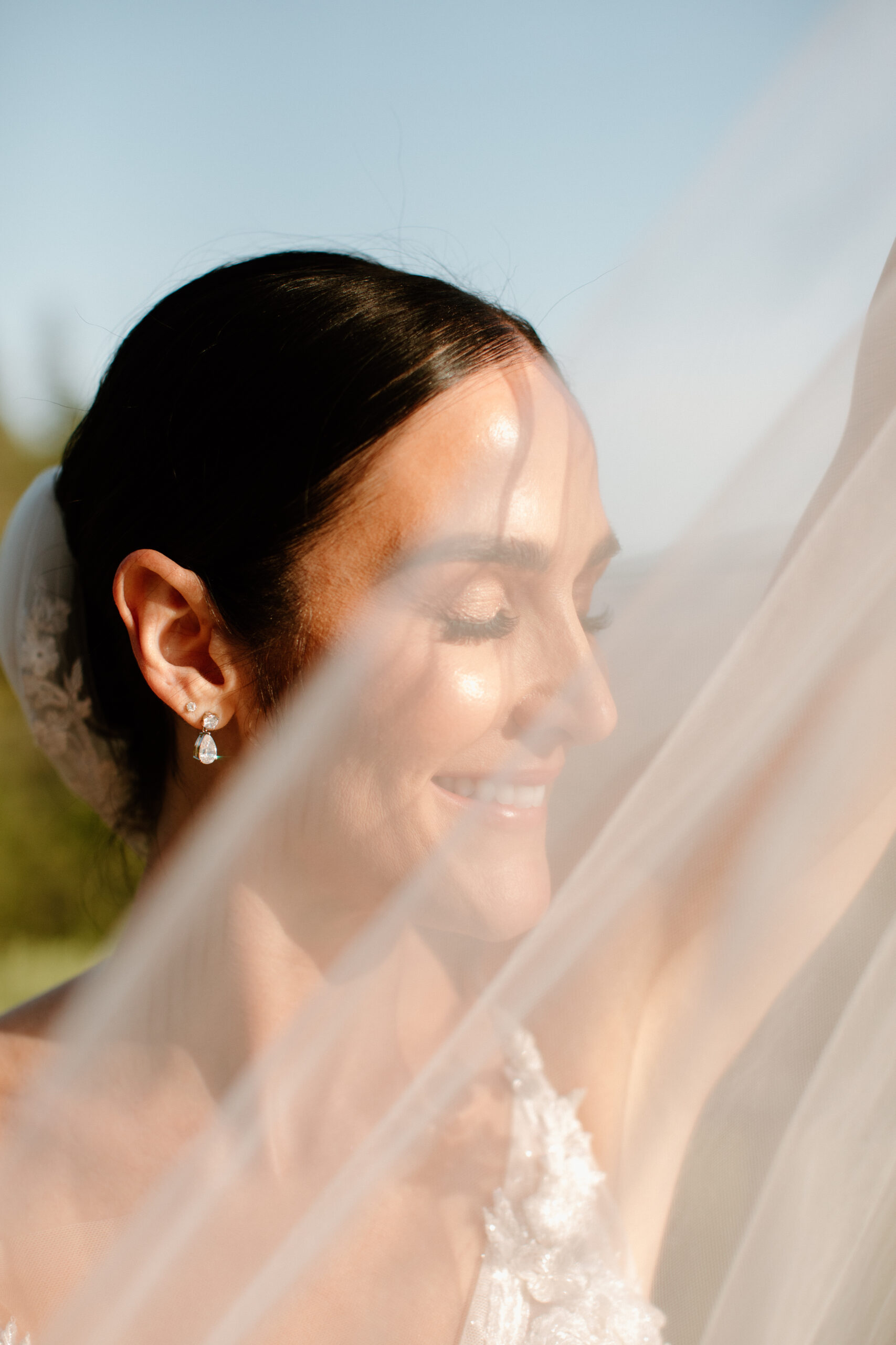 bride poses after her dreamy mountain view wedding