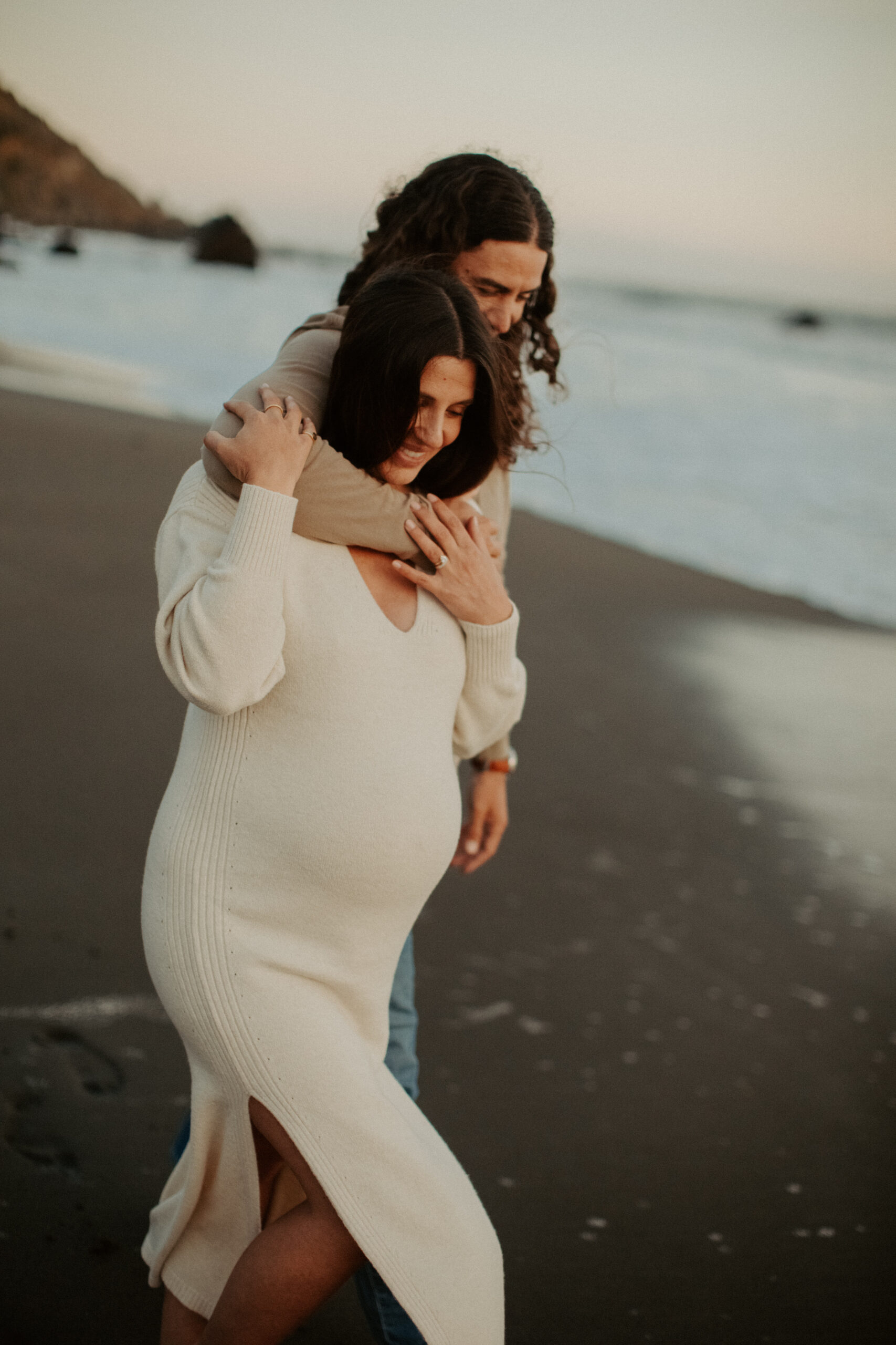 stunning couple pose together on the California coast