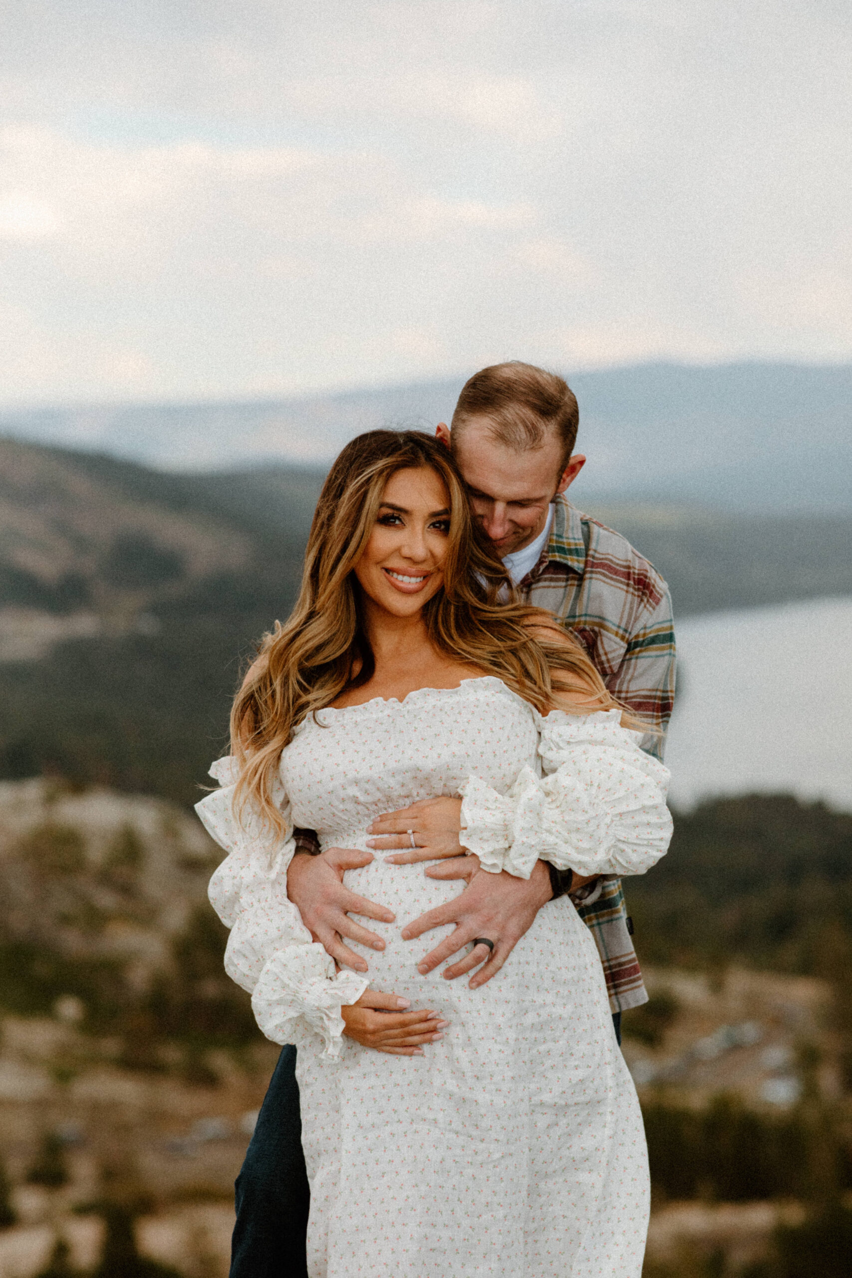 stunning couple pose together during their outdoor Northern California maternity photoshoot