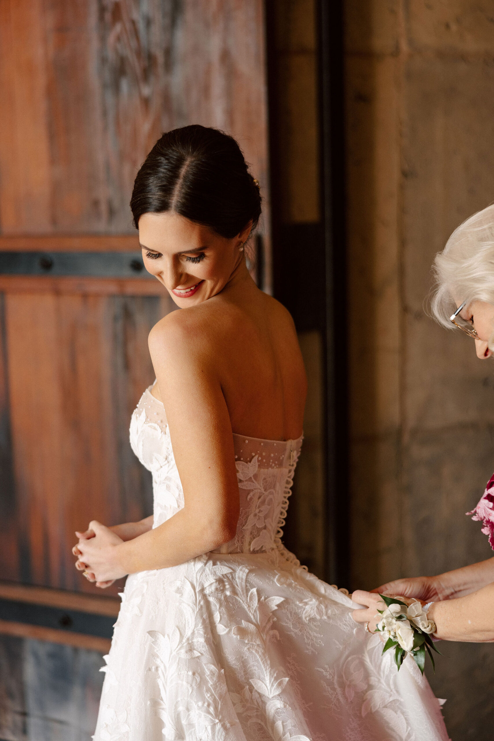 bride poses shortly after finishing her prep