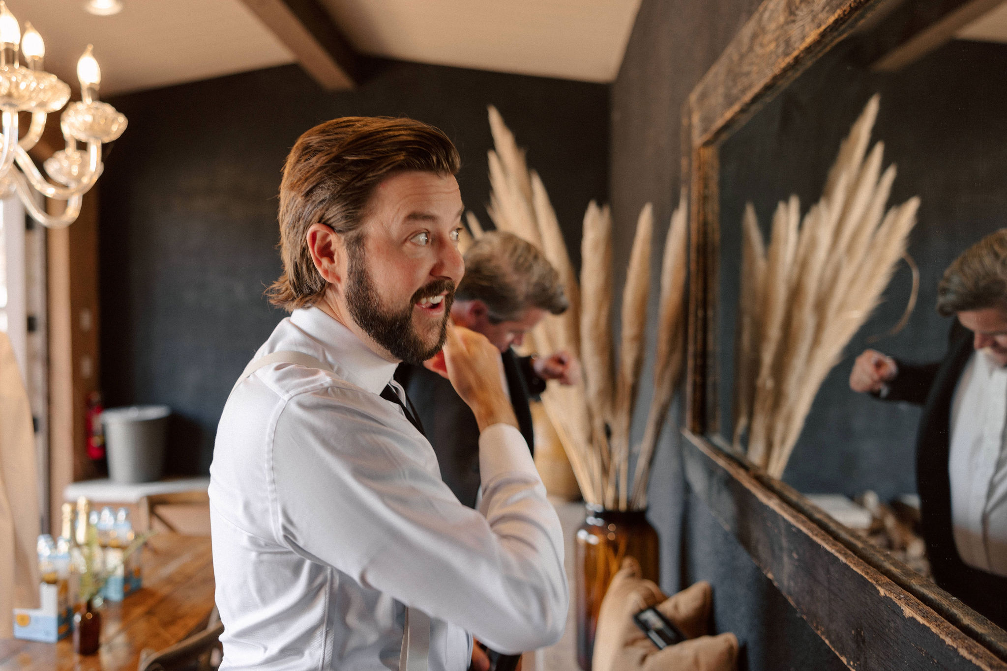 groomsmen prepares for his dreamy California wedding day with his groomsmen