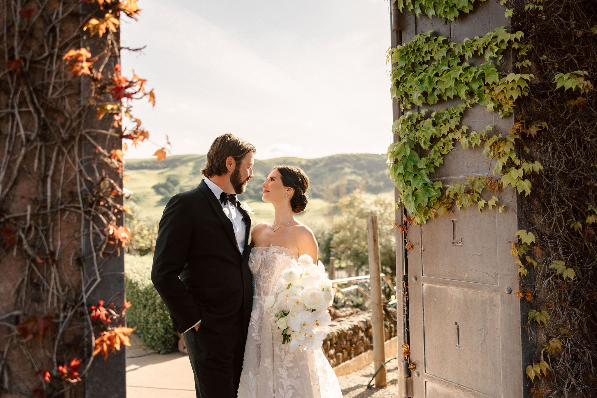 beautiful bride and groom pose together on their stunning California winery wedding day