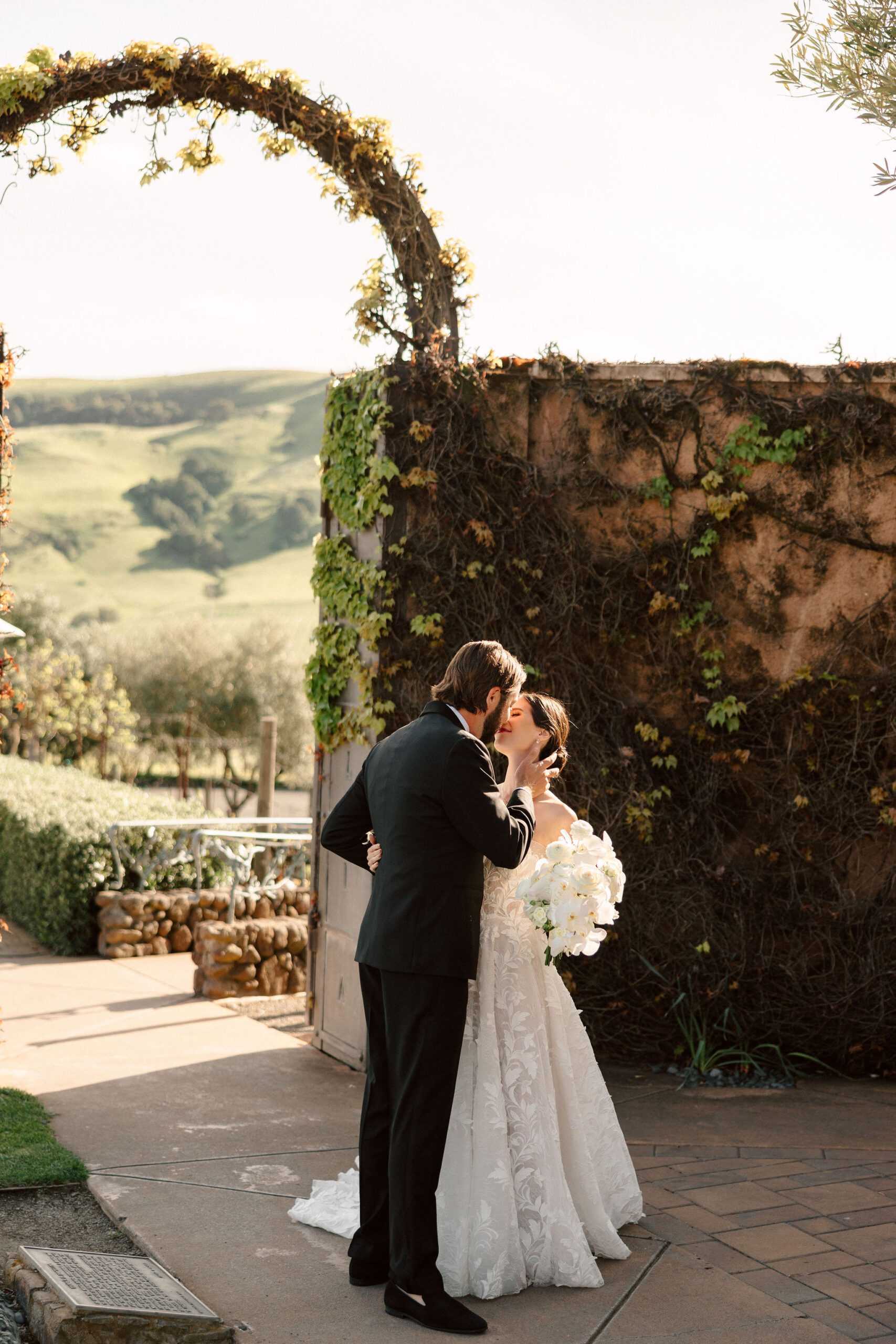 beautiful bride and groom pose together on their stunning California winery wedding day