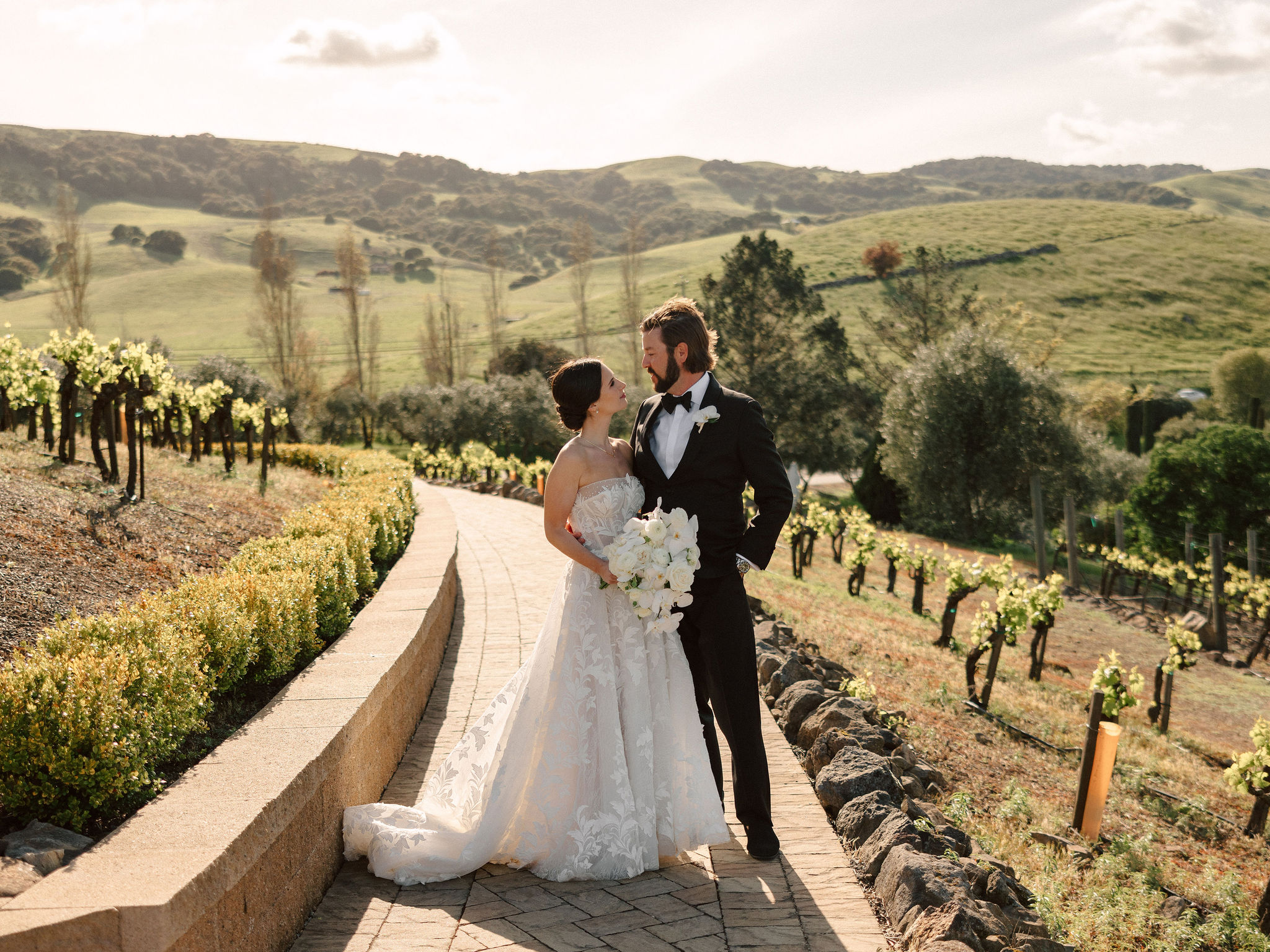 beautiful bride and groom pose together on their stunning California winery wedding day