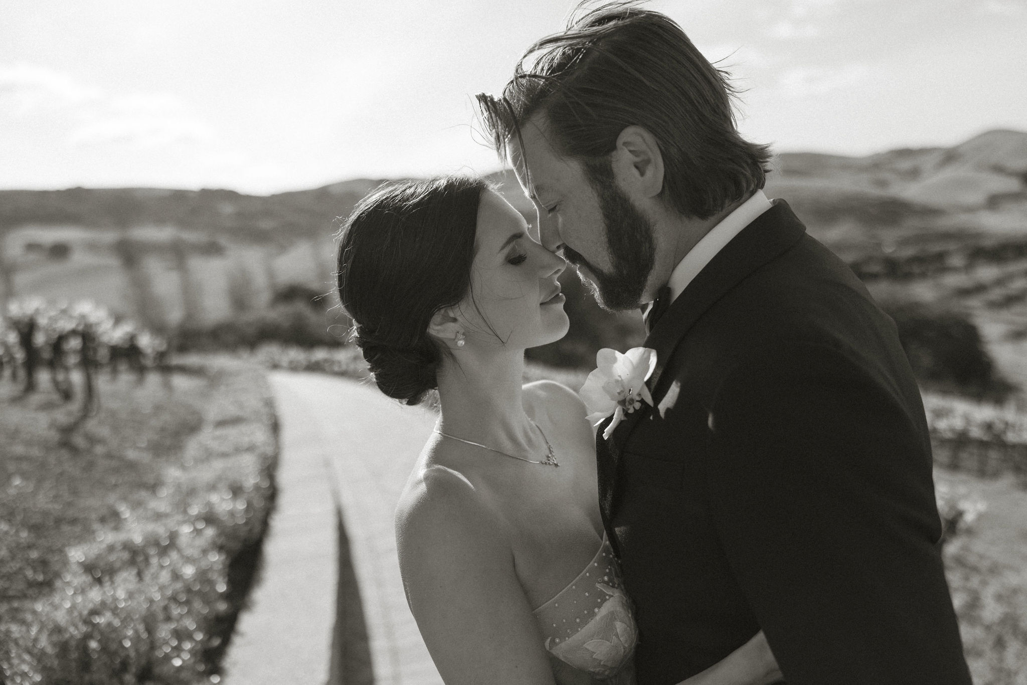 beautiful bride and groom pose together on their stunning California winery wedding day