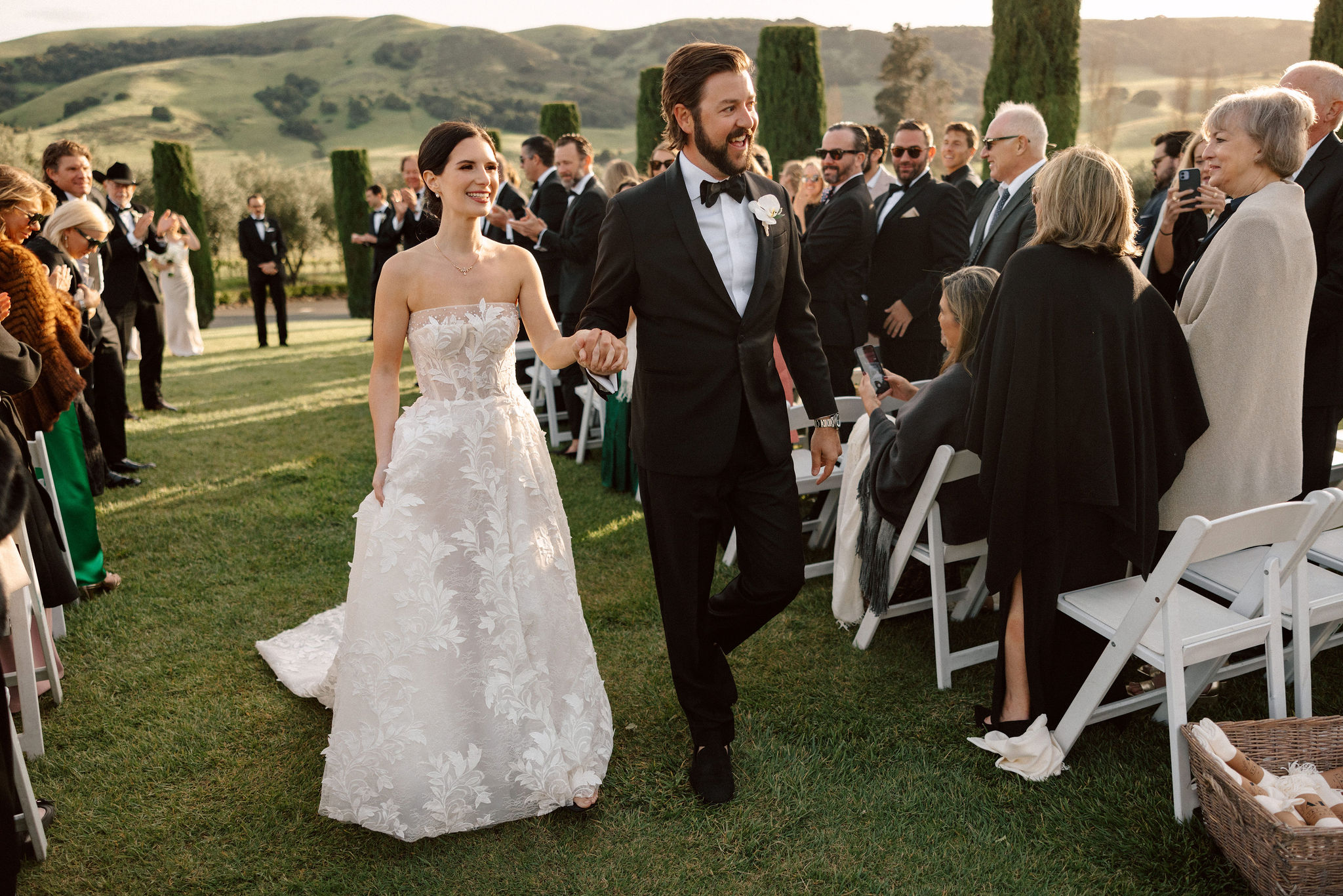 bride and groom exit their dreamy winery wedding ceremony