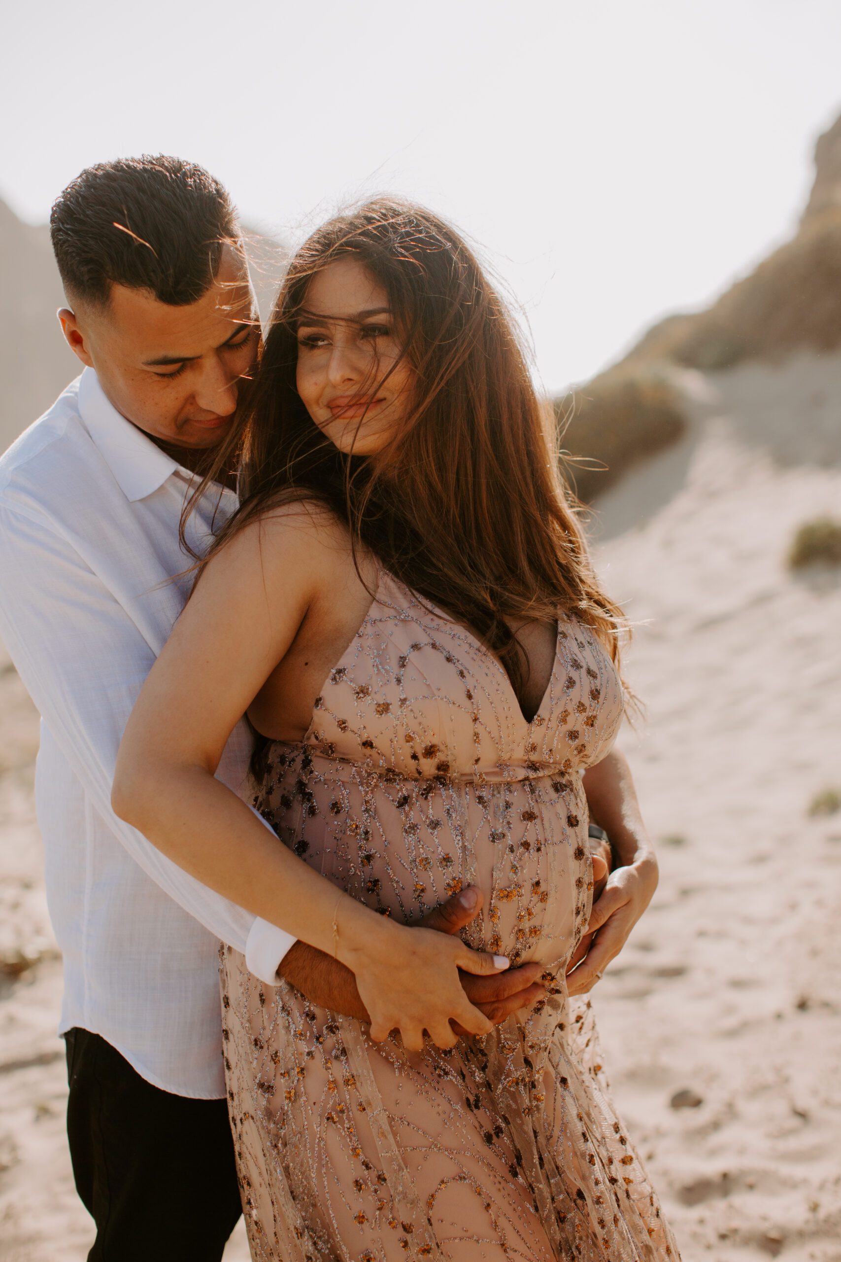 stunning couple pose together on the California coast