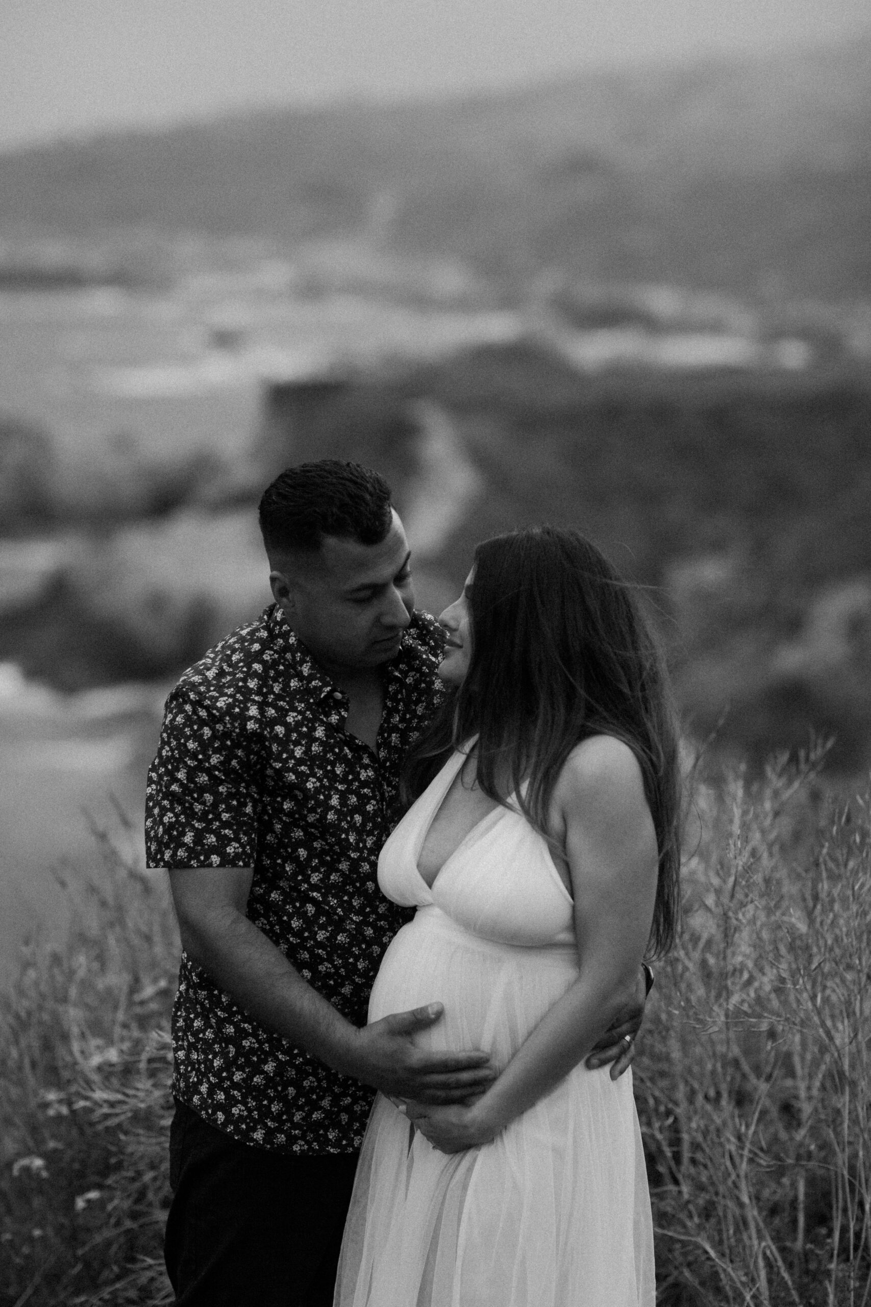 stunning couple pose together during their outdoor Northern California maternity photoshoot