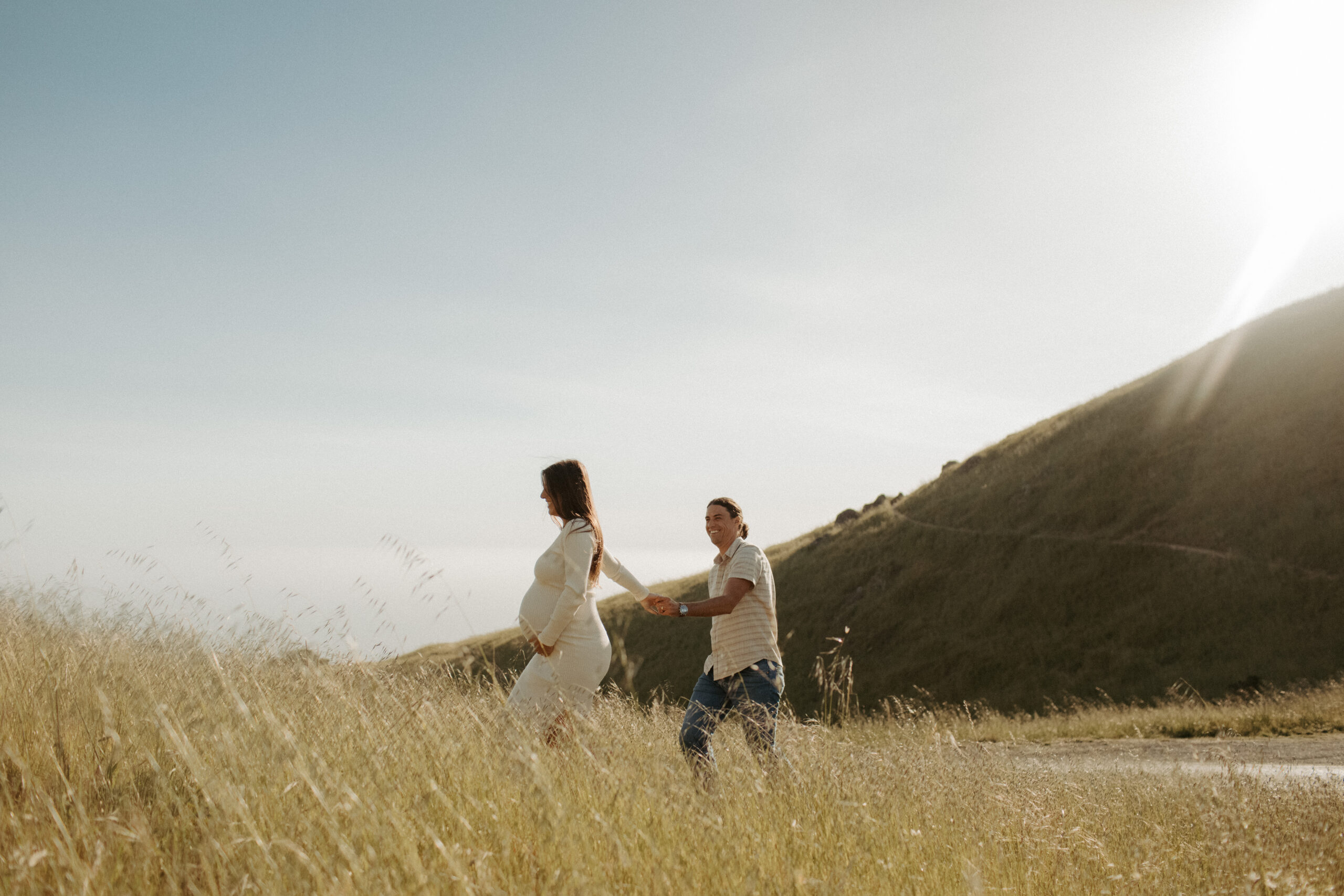 stunning couple pose together on the California coast