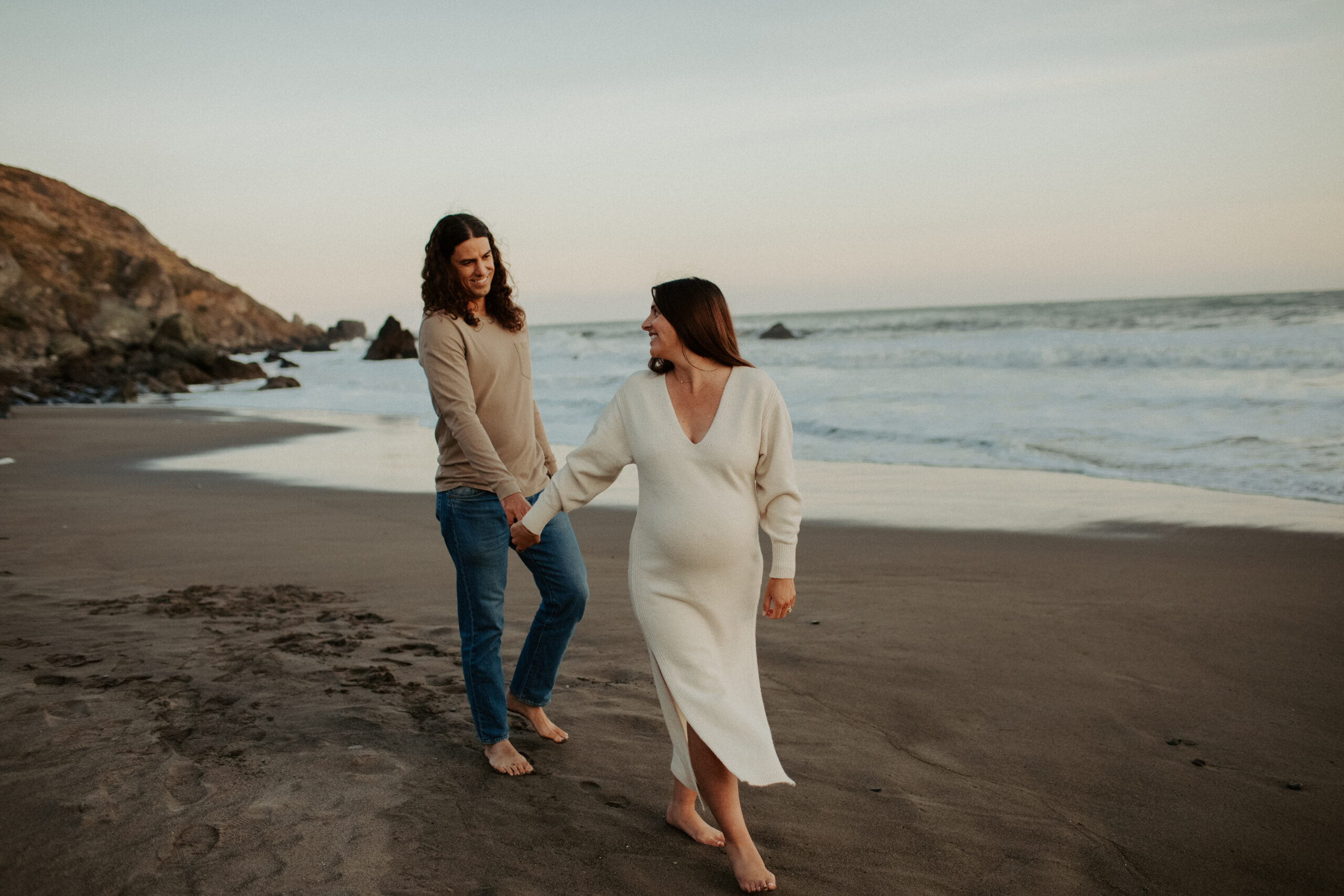 stunning couple pose together on the California coast