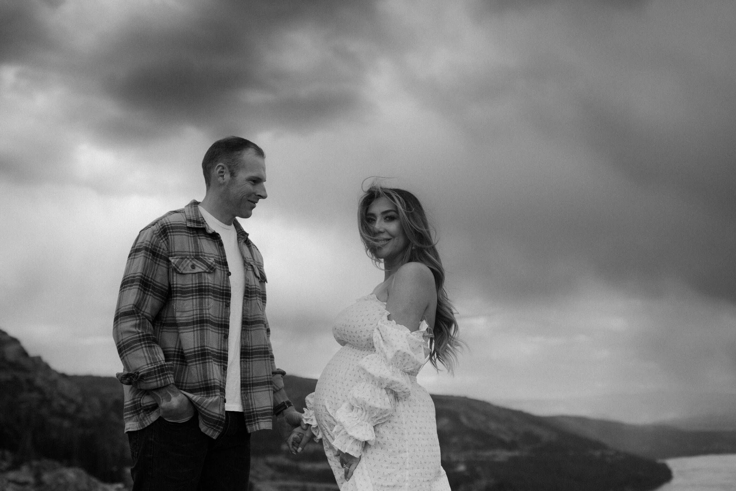 stunning couple pose together during their outdoor Northern California maternity photoshoot