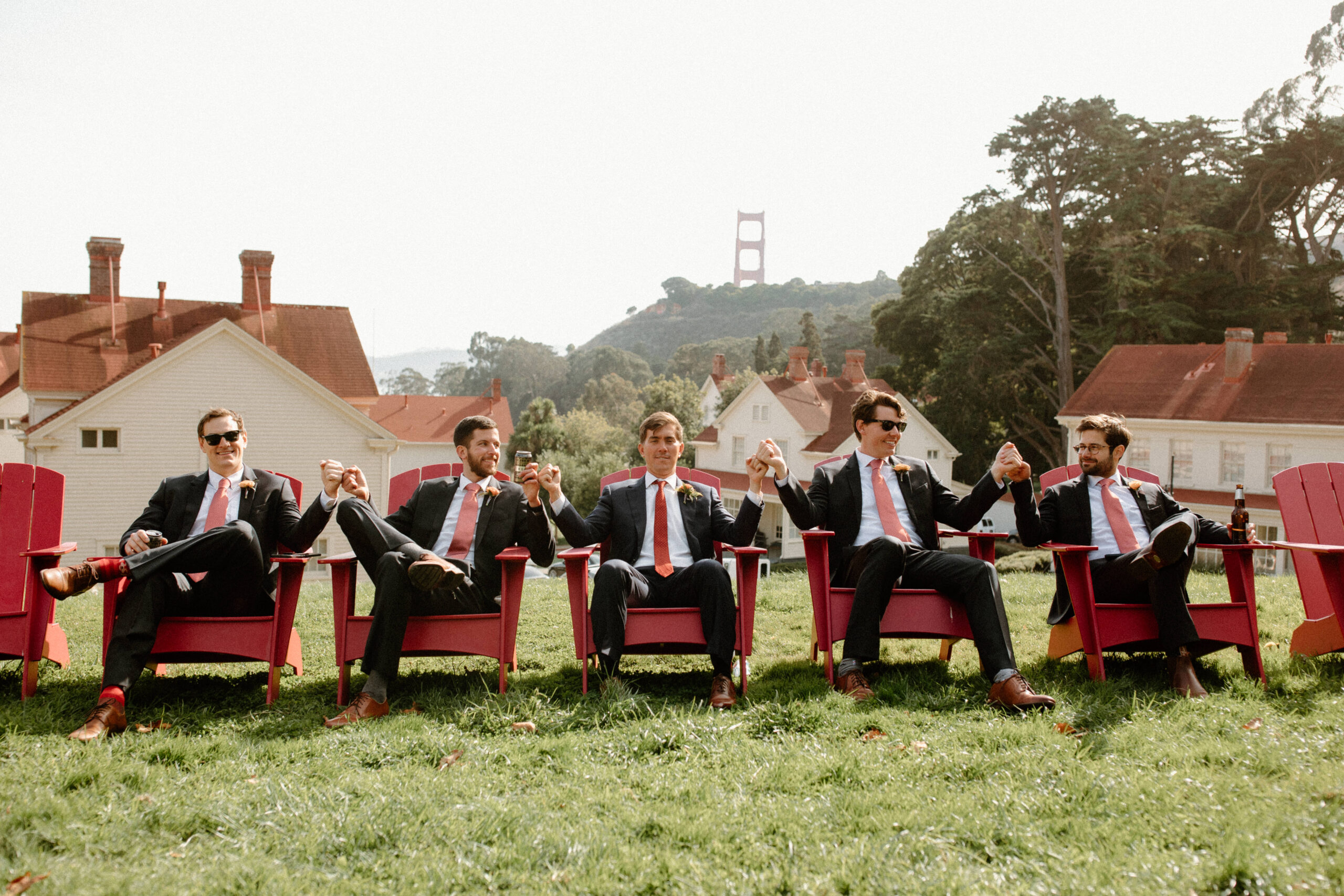 groomsmen pose together