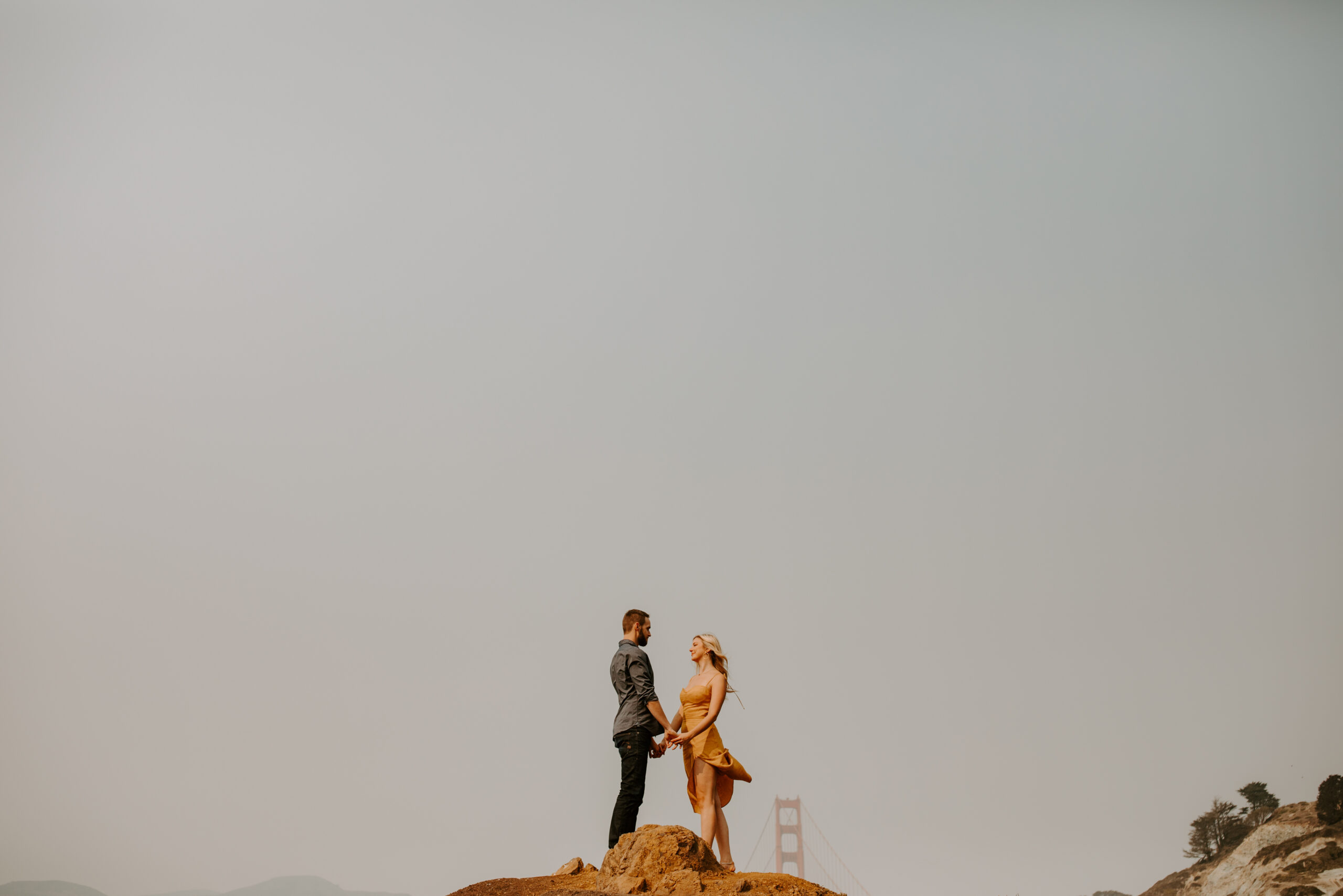 couple share a laugh during their documentary style engagement photoshoot