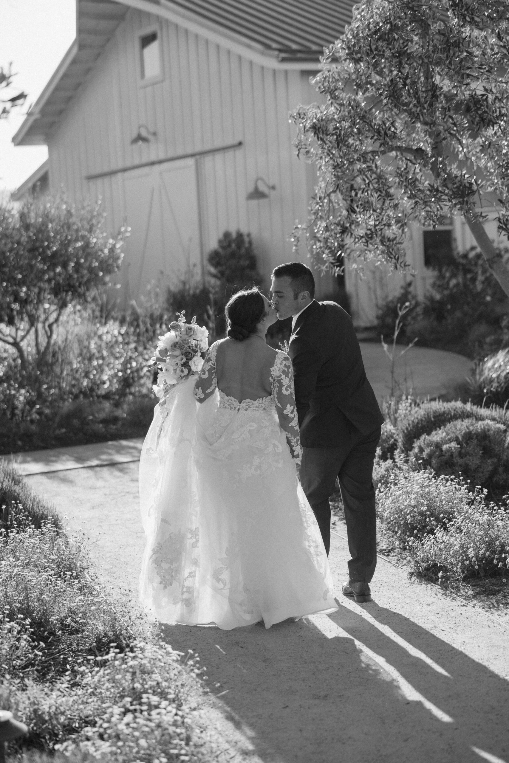 beautiful bride and groom take photos together in the California wine country