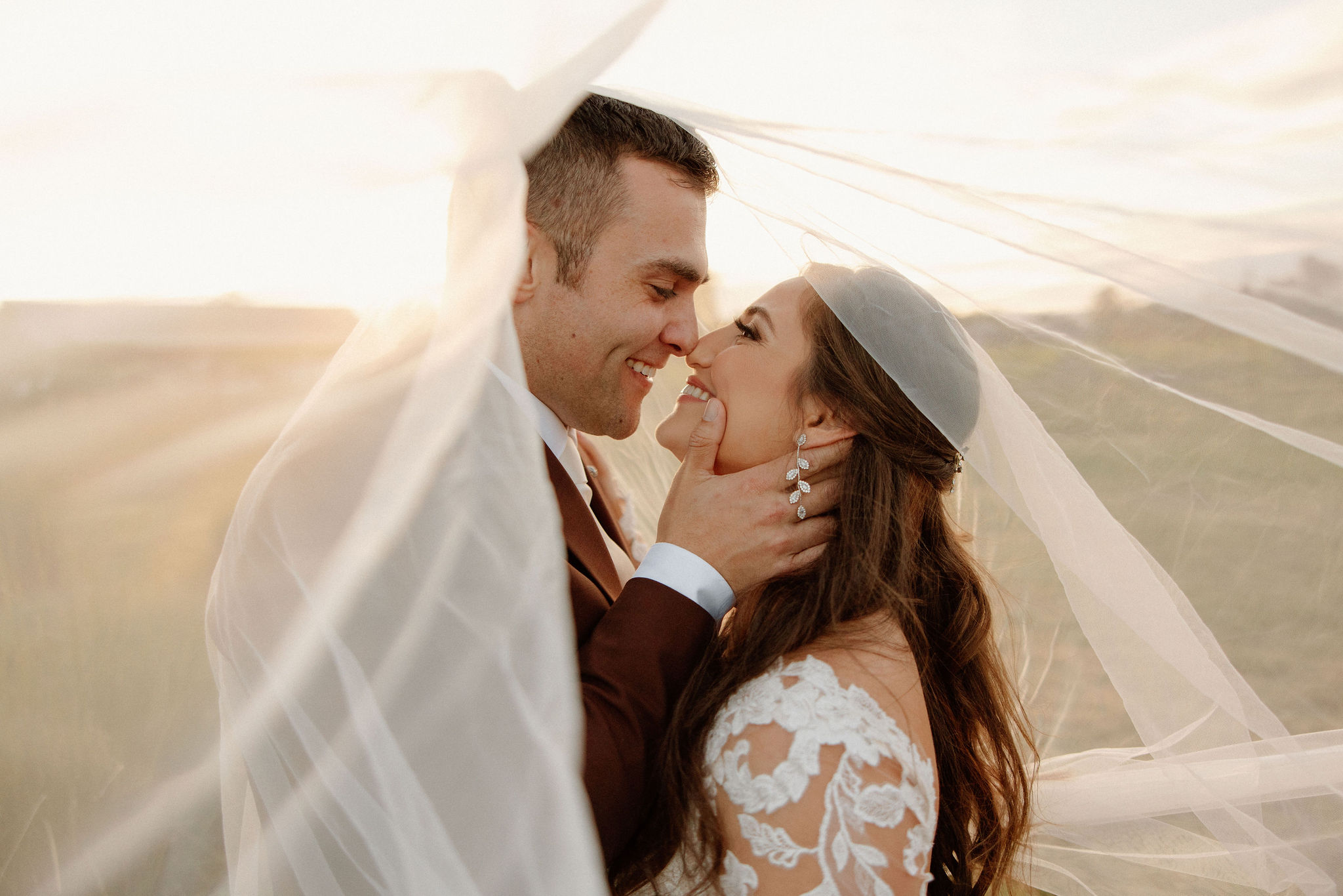 beautiful bride and groom take photos together in the California wine country