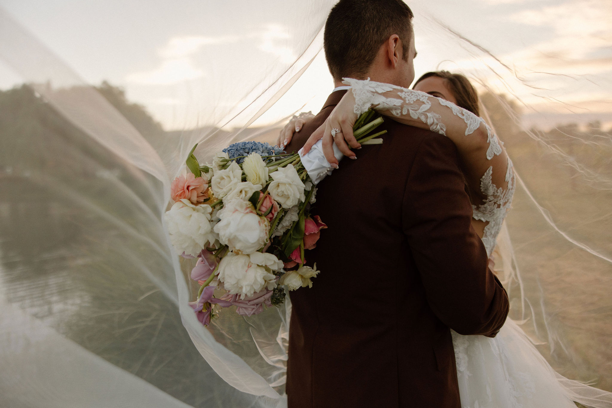 beautiful bride and groom take photos together in the California wine country