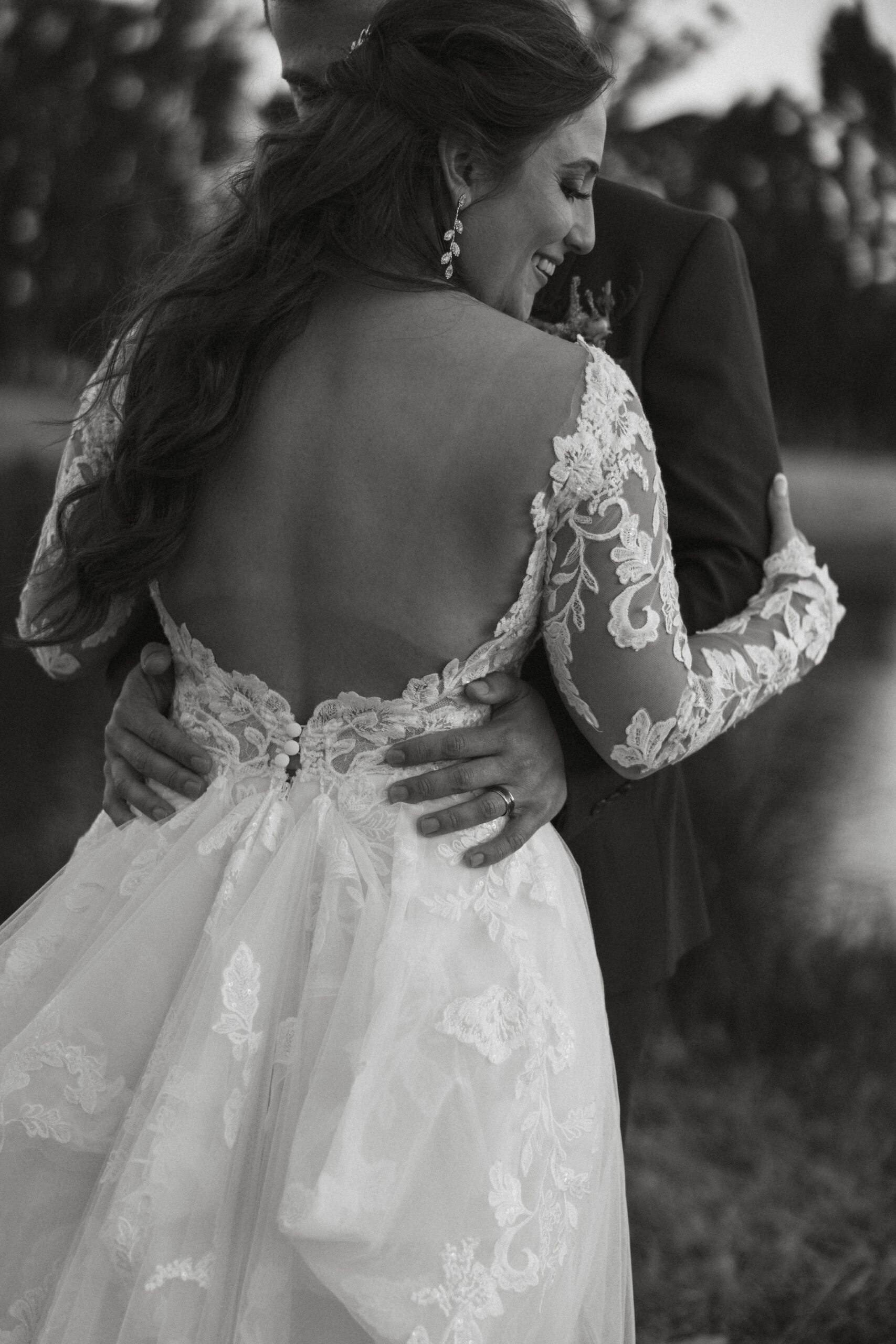 beautiful bride and groom take photos together in the California wine country