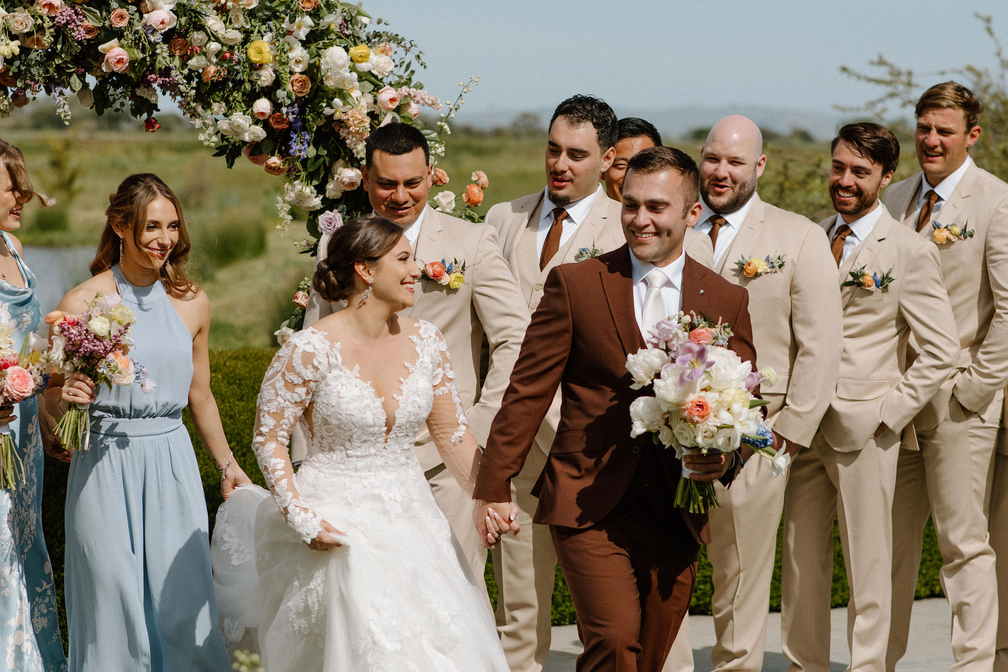 beautiful bride and groom take photos together in the California wine country