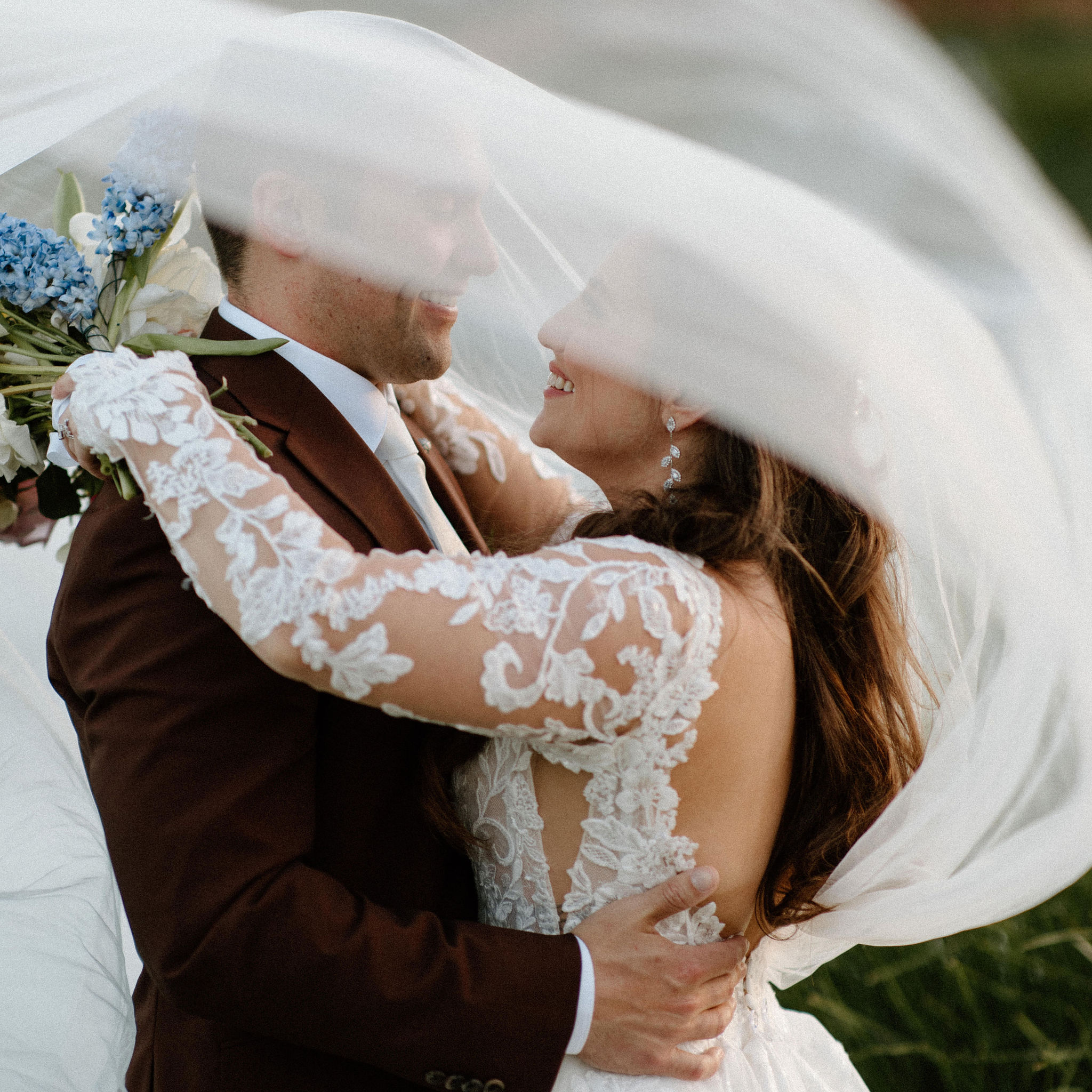 beautiful bride and groom take photos together in the California wine country