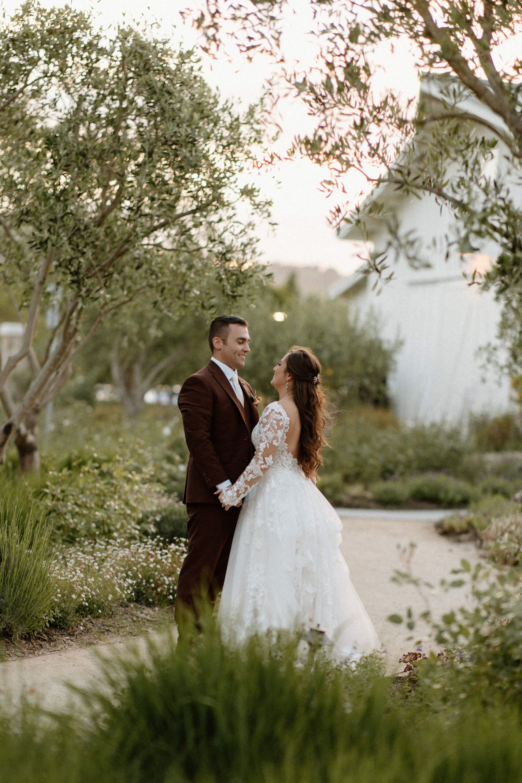 beautiful bride and groom take photos together in the California wine country