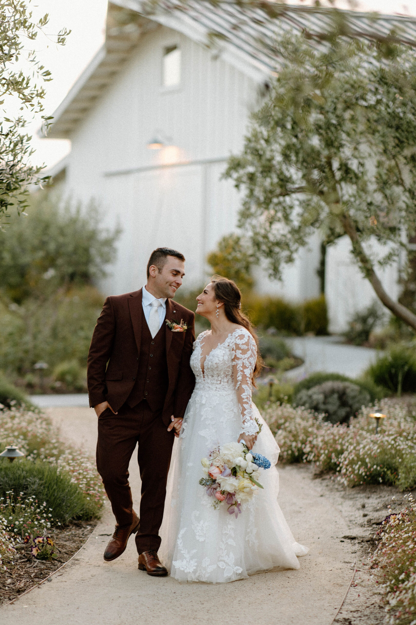 beautiful bride and groom take photos together in the California wine country